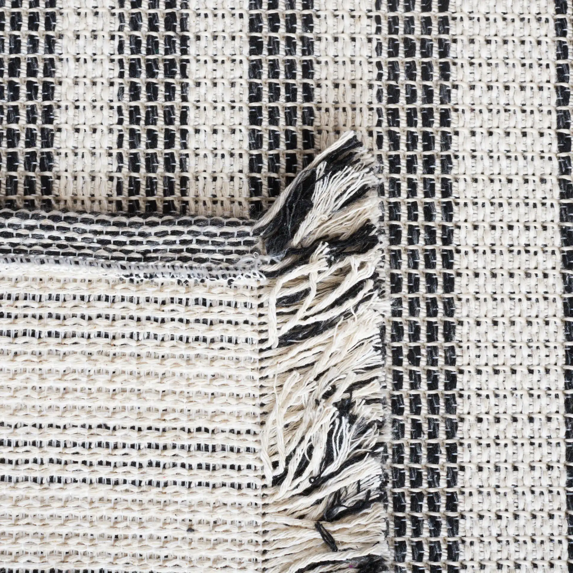 Augustine Striped Rug in Ivory / Black in a styled room