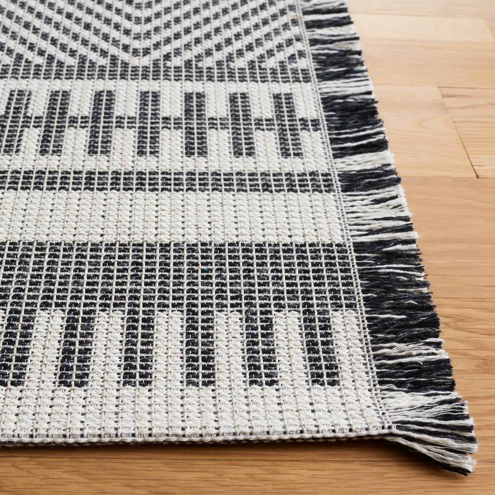 Augustine Nested Diamond Rug in Ivory / Black in a styled room