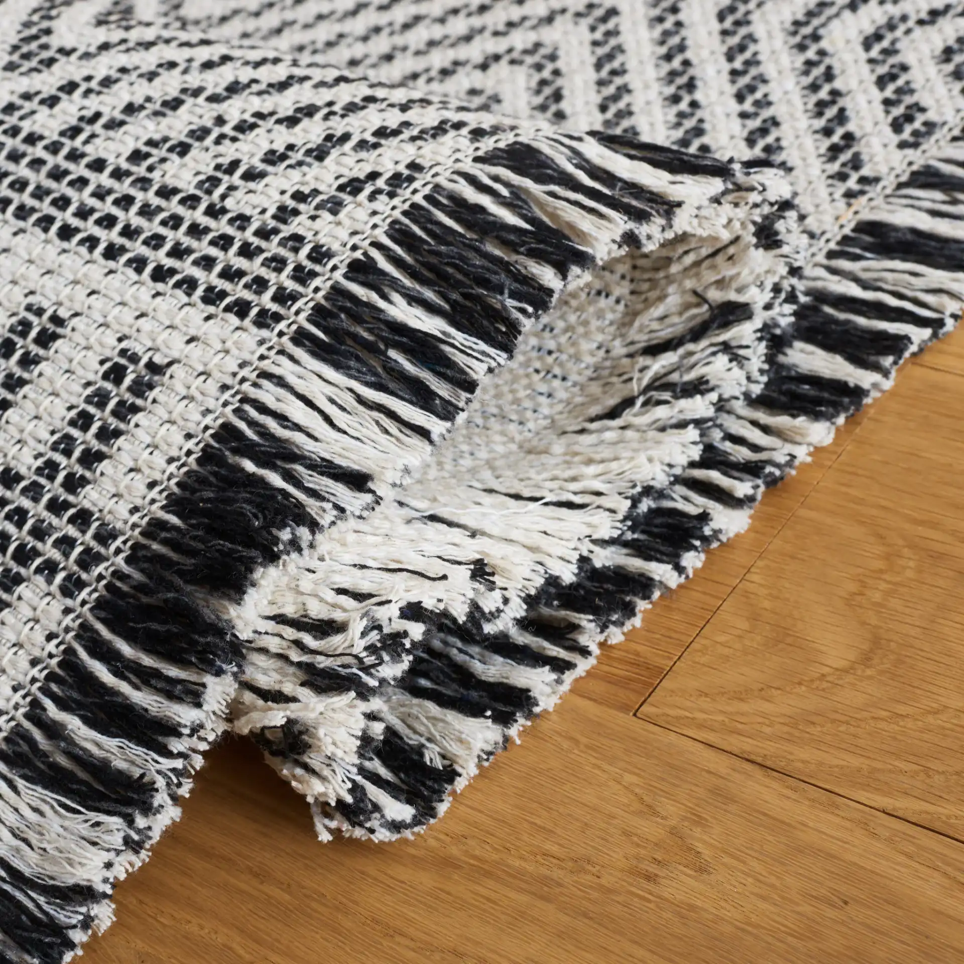 Augustine Nested Diamond Rug in Ivory / Black in a styled room
