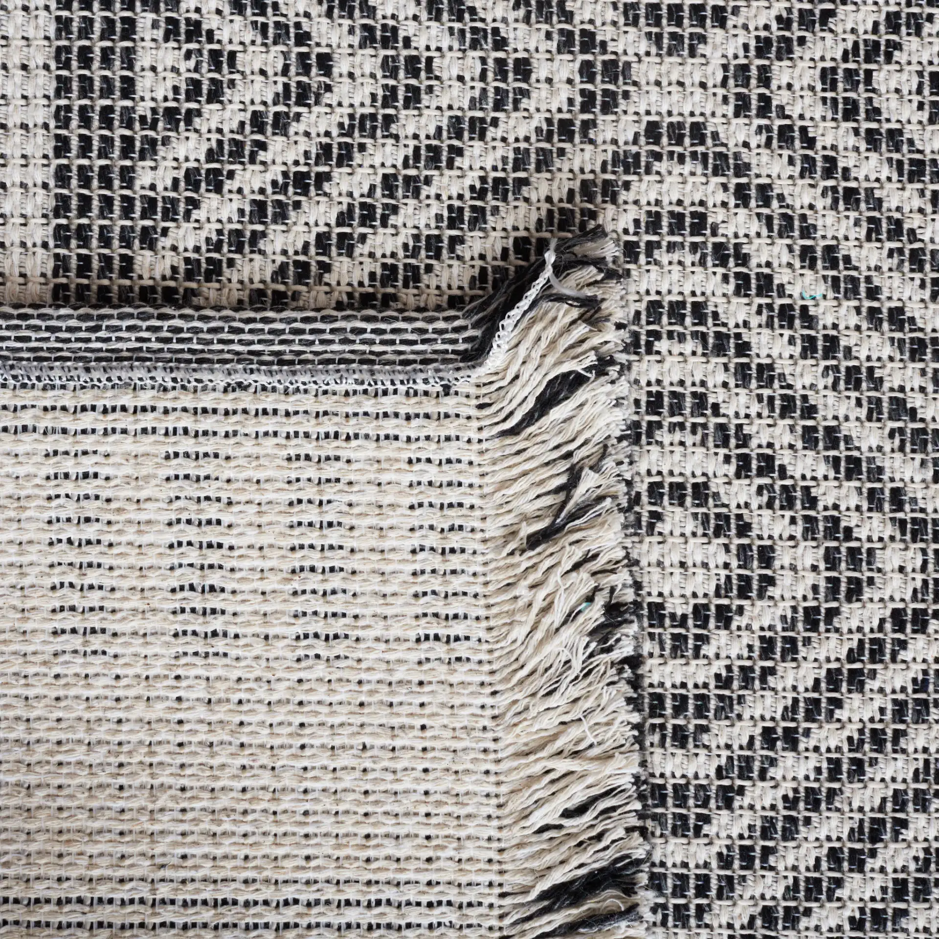 Augustine Nested Diamond Rug in Ivory / Black in a styled room