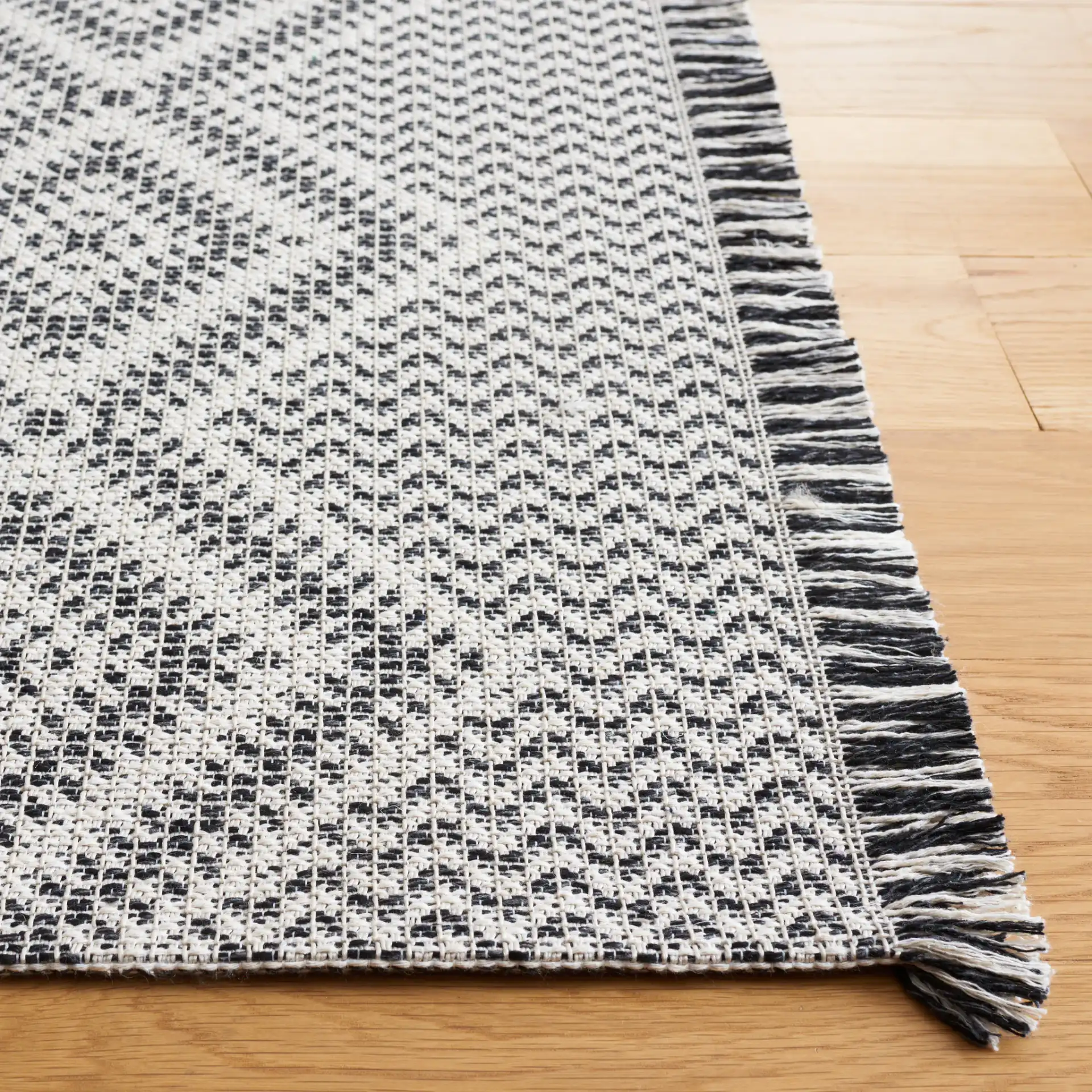 Augustine Diamond Column Rug in Ivory / Black in a styled room