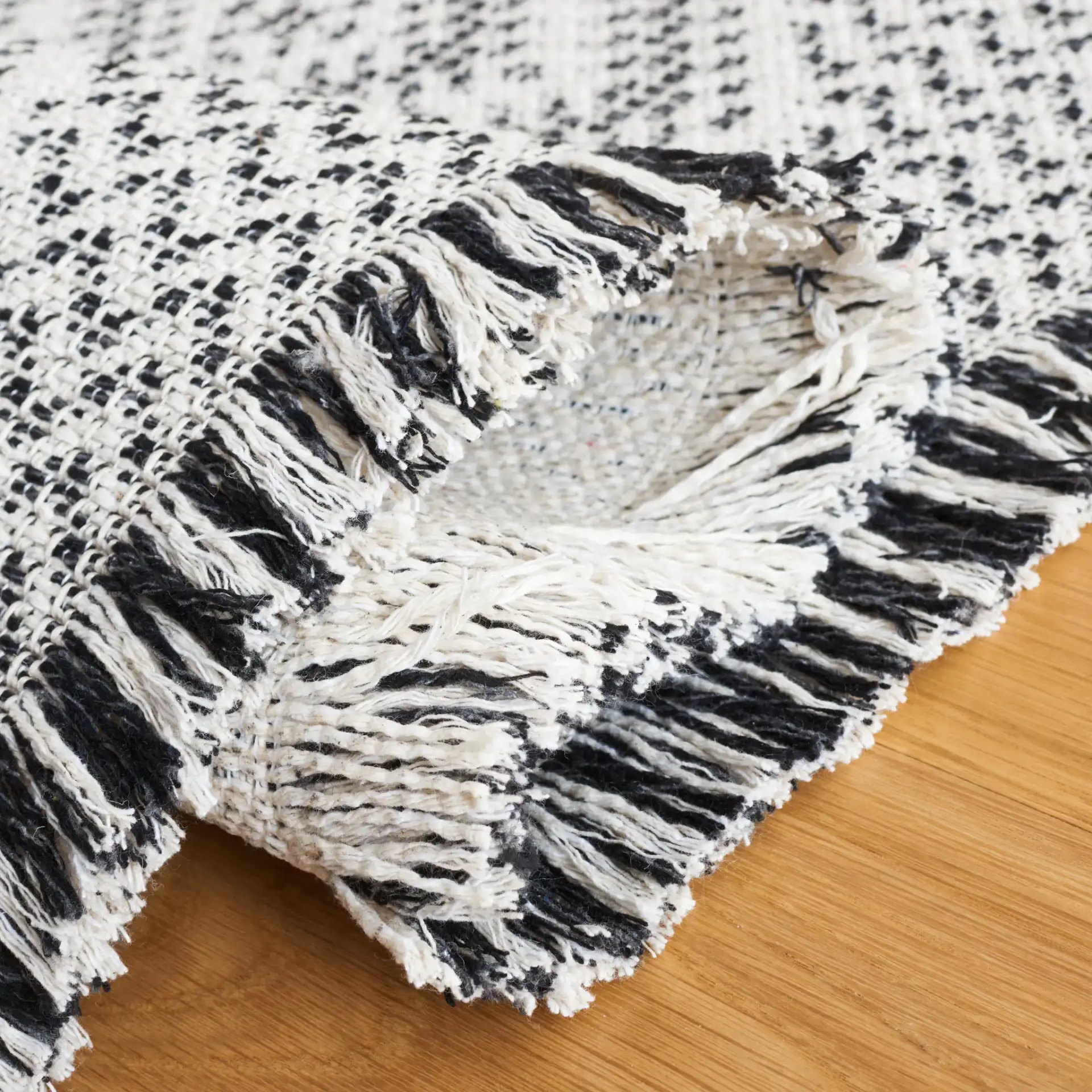 Augustine Diamond Column Rug in Ivory / Black in a styled room