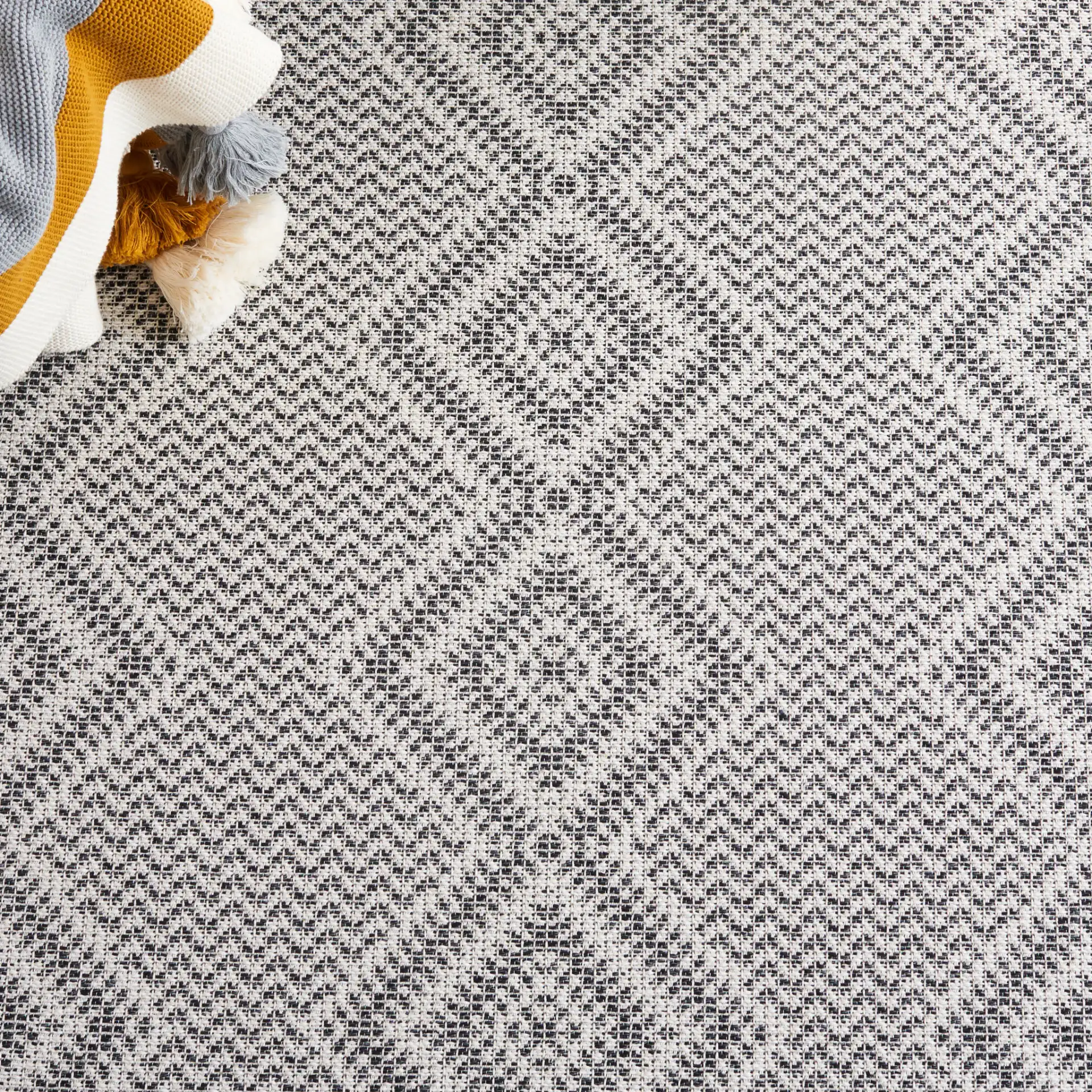 Augustine Diamond Column Rug in Ivory / Black in a styled room
