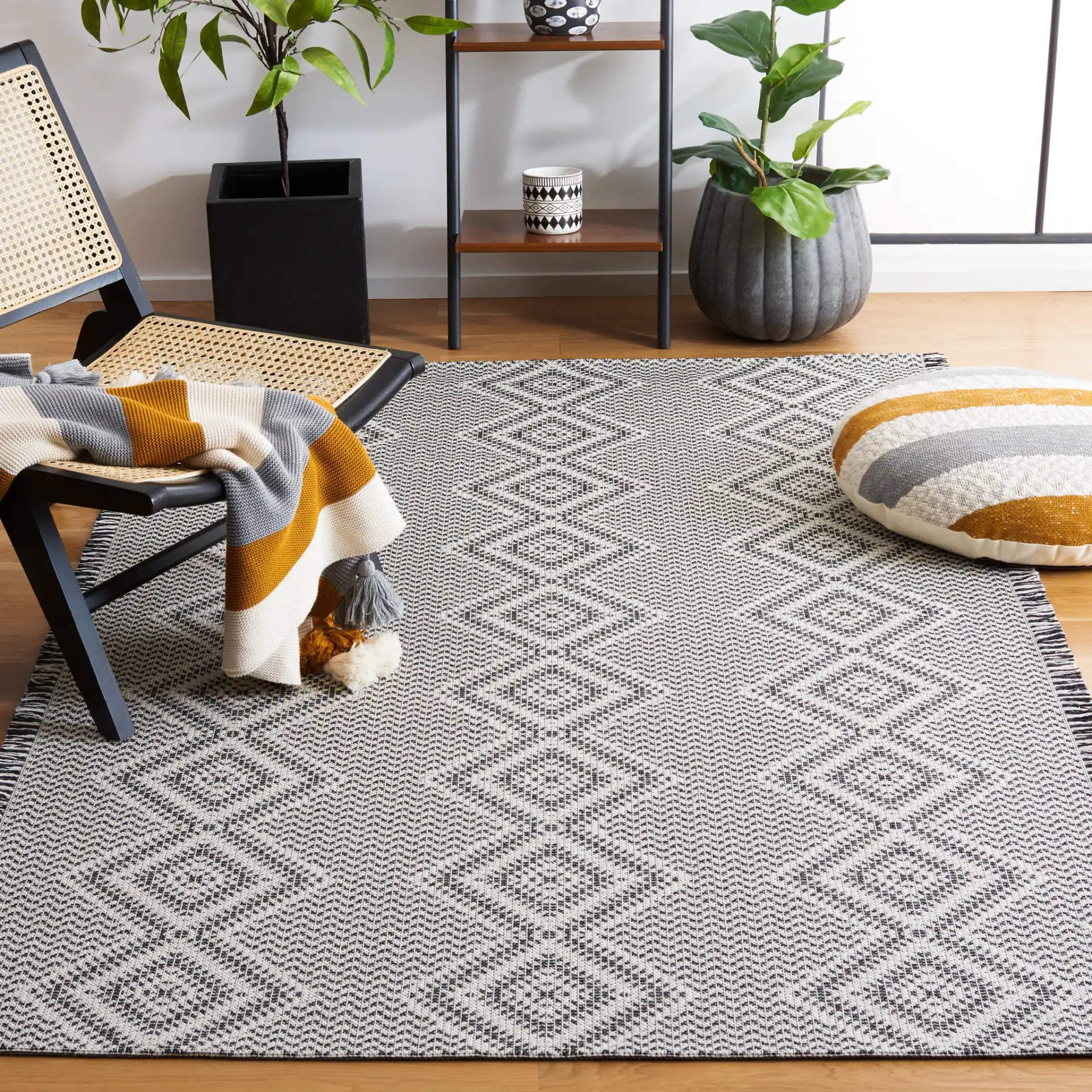 Augustine Diamond Column Rug in Ivory / Black in a styled room