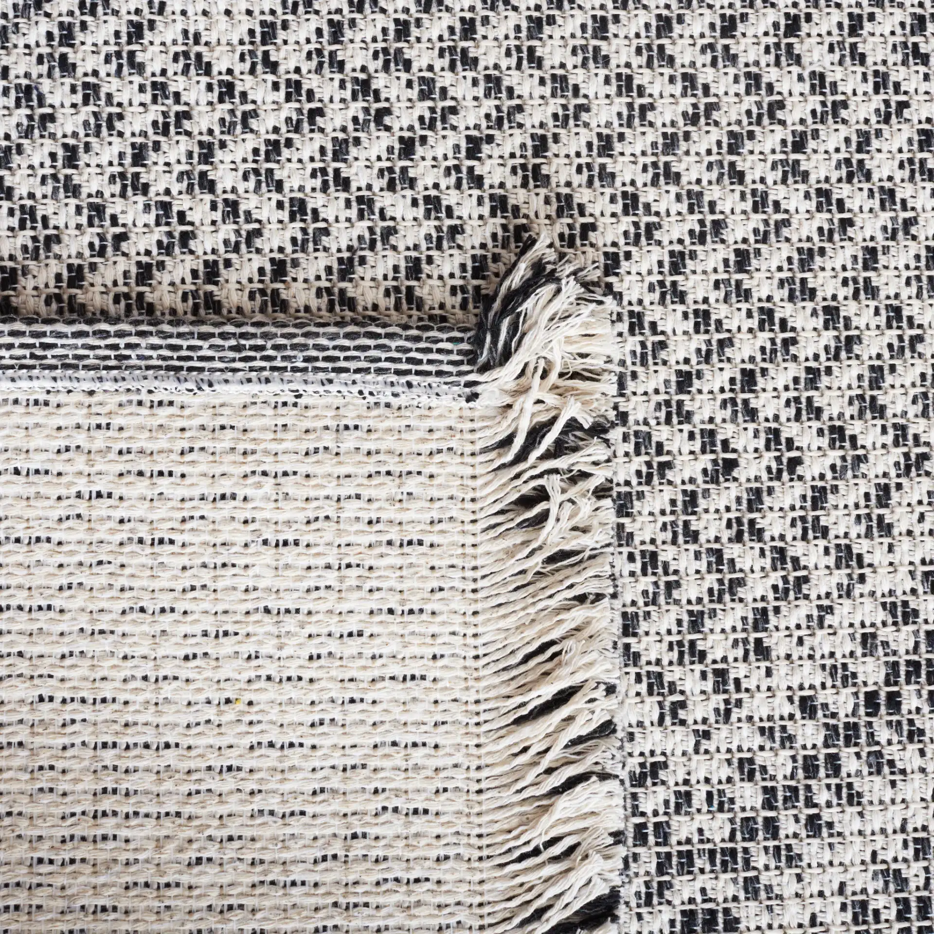 Augustine Diamond Column Rug in Ivory / Black in a styled room