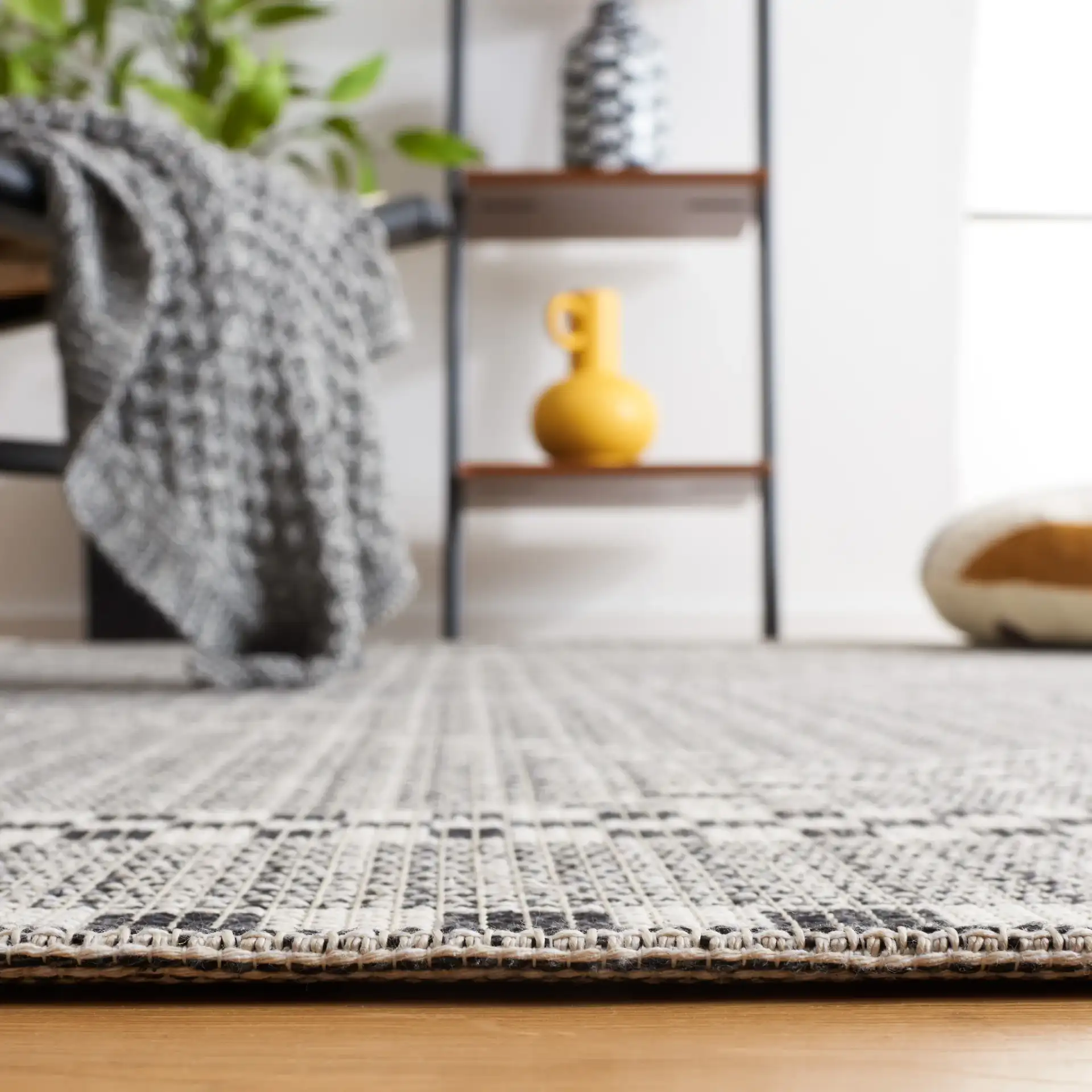 Augustine Large Scale Diamond Rug in Ivory / Black in a styled room