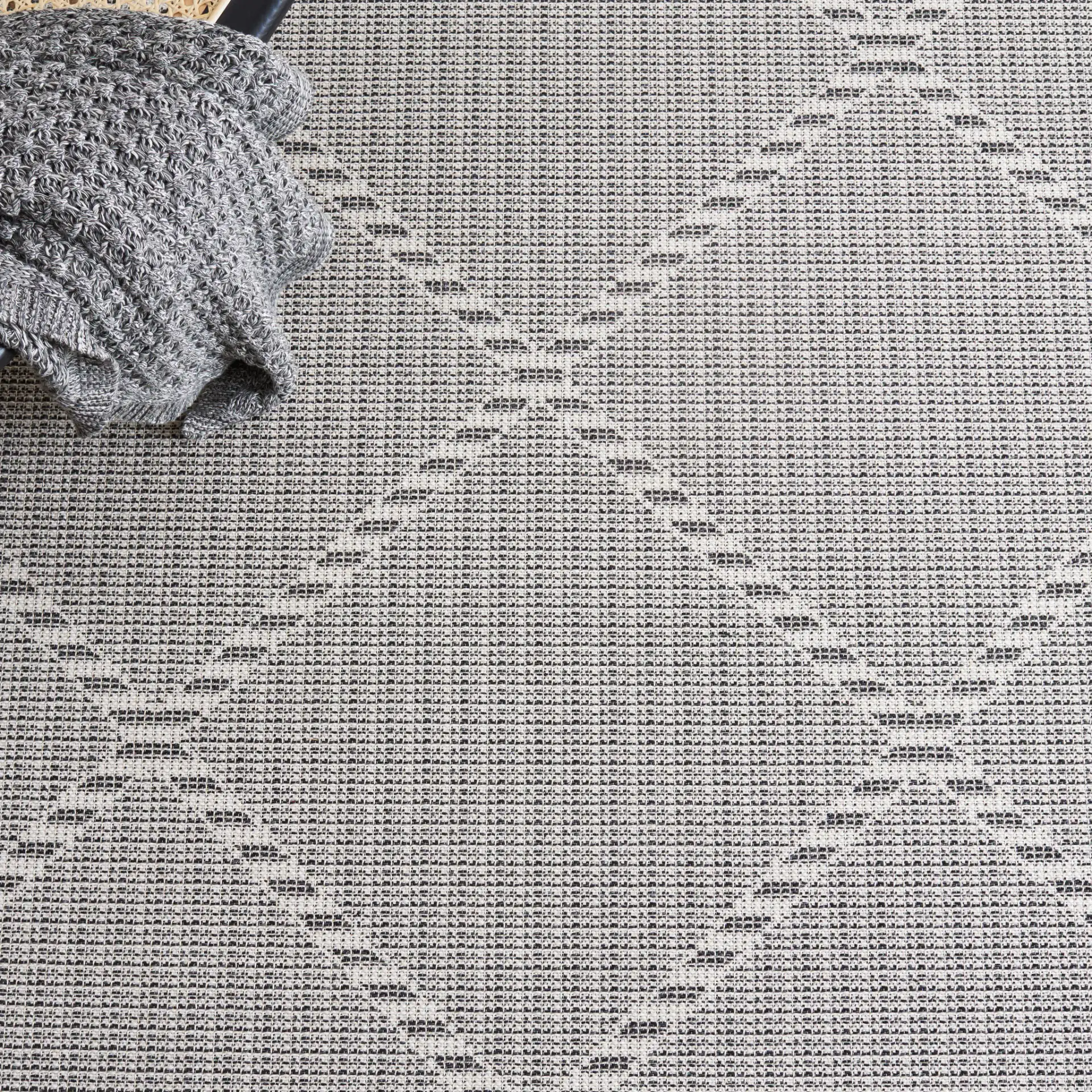 Augustine Large Scale Diamond Rug in Ivory / Black in a styled room