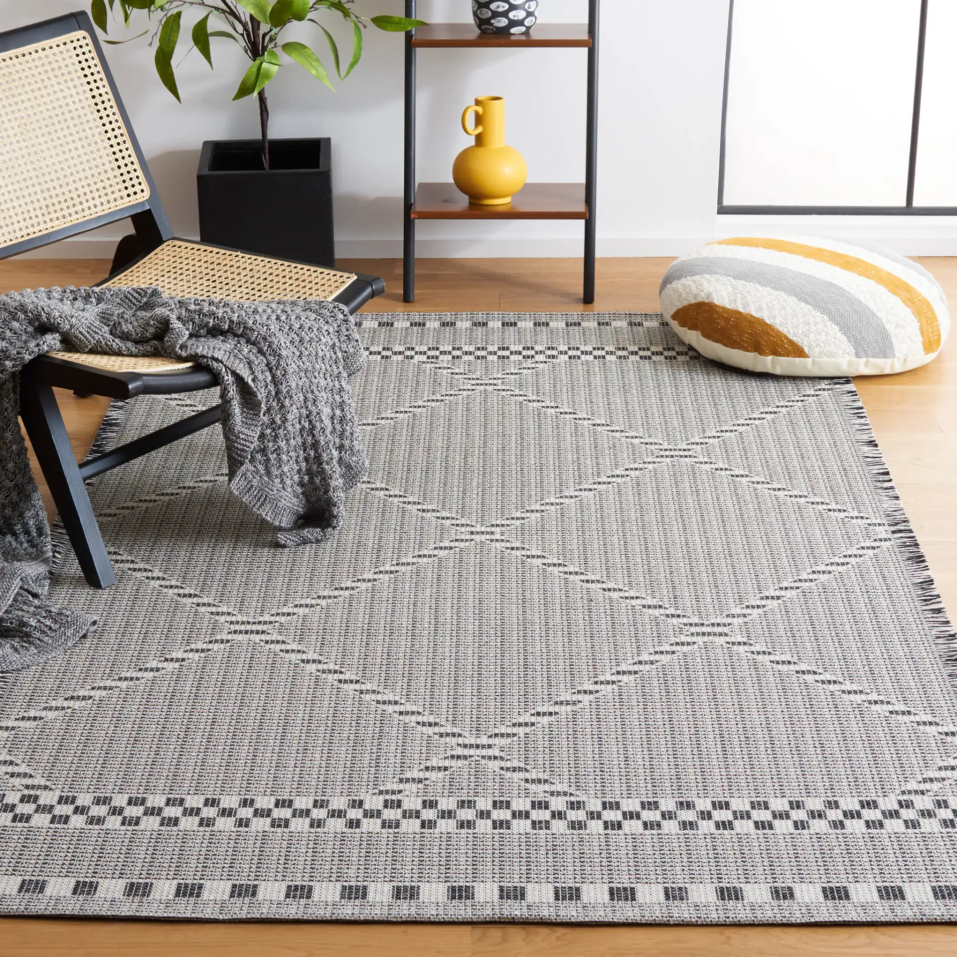 Augustine Large Scale Diamond Rug in Ivory / Black in a styled room