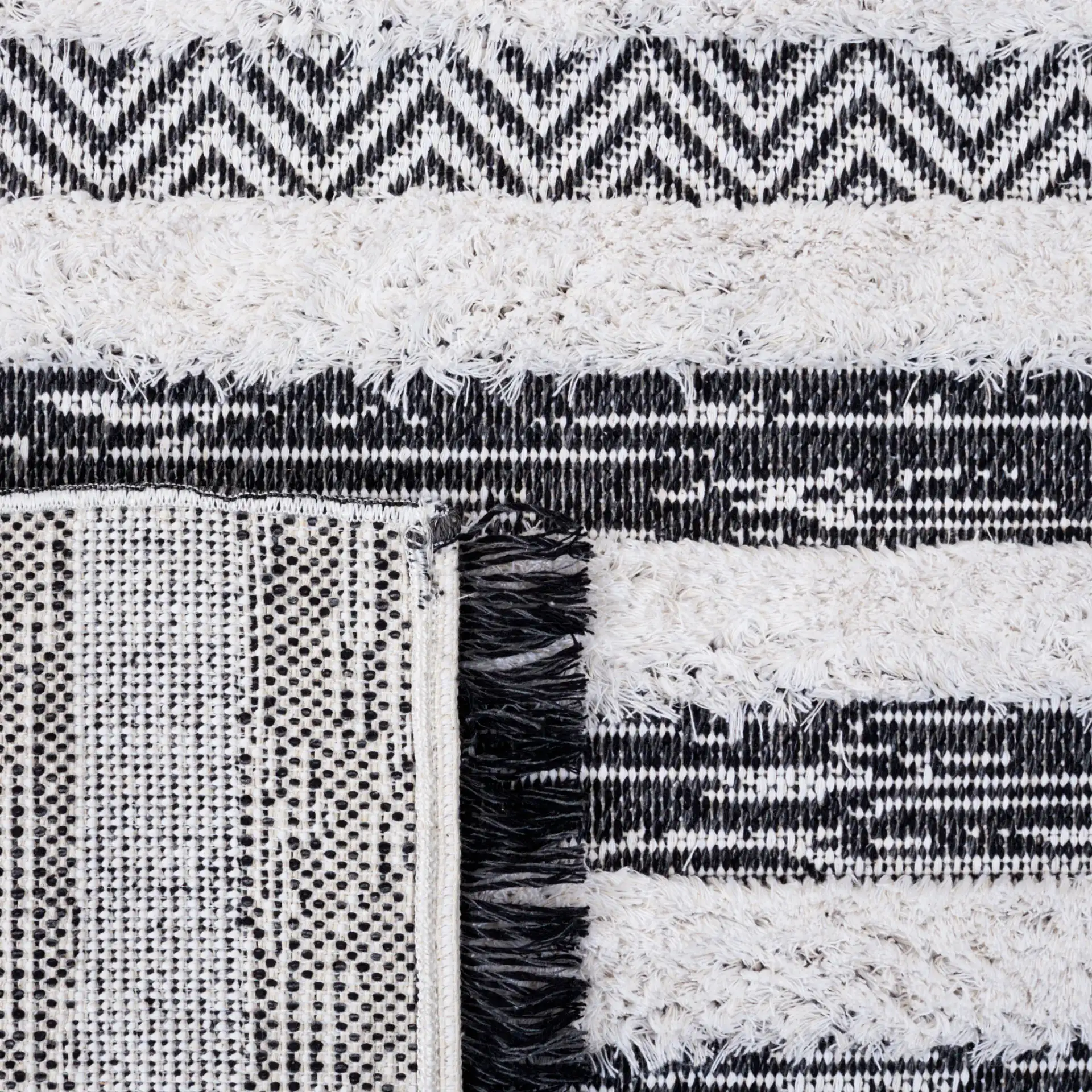 Augustine Banded Chevron Rug in Black / Ivory in a styled room