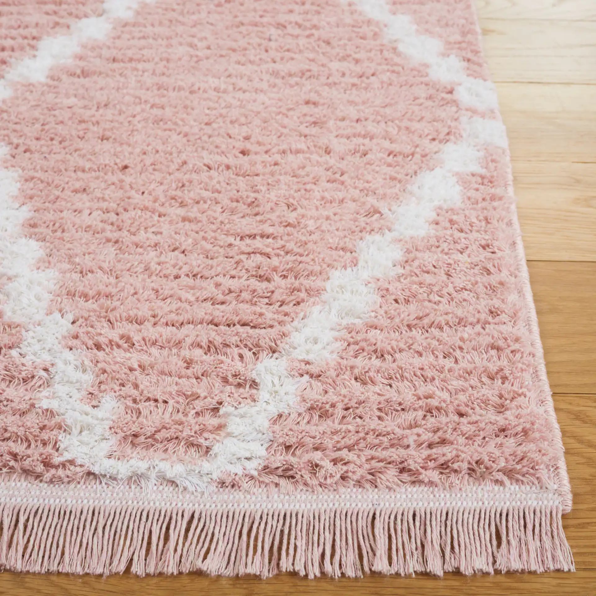 Augustine Diamond Trellis Rug in Pink / Ivory in a styled room
