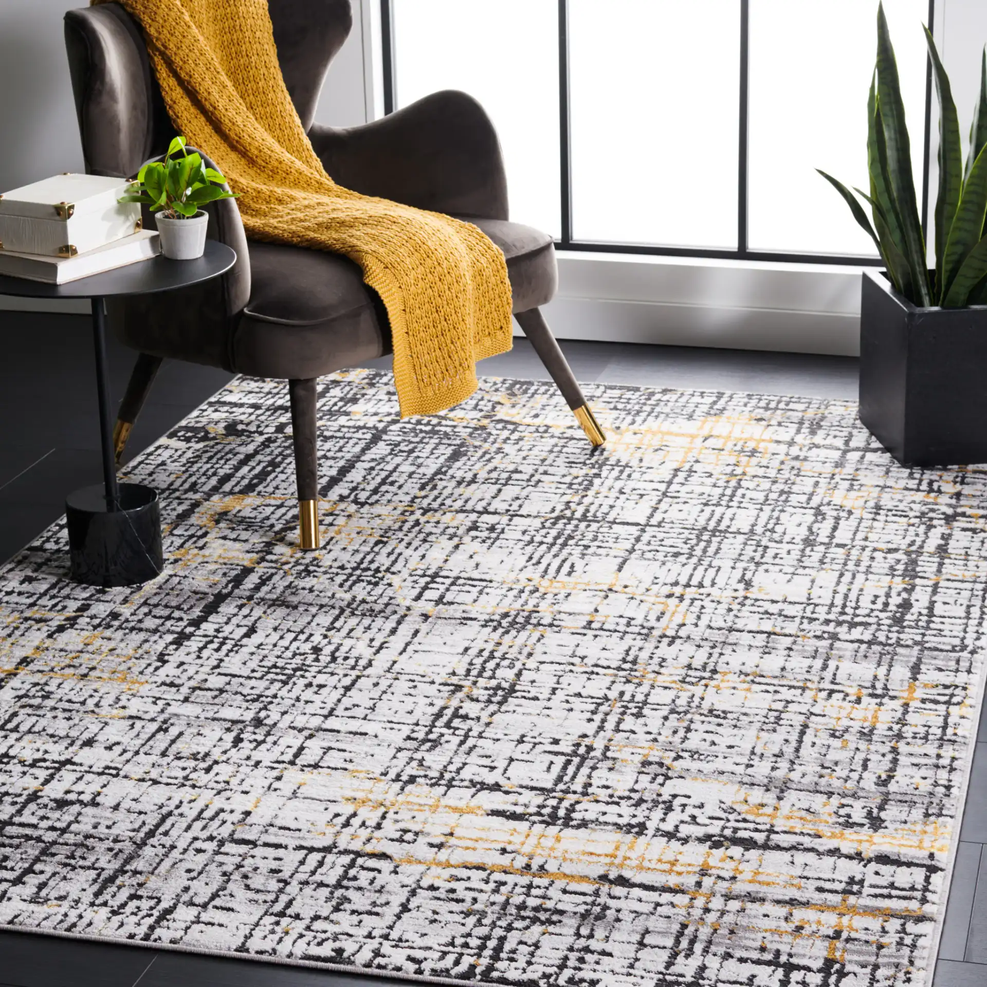 Amelia Distressed Grid Rug in Charcoal / Gold in a styled room