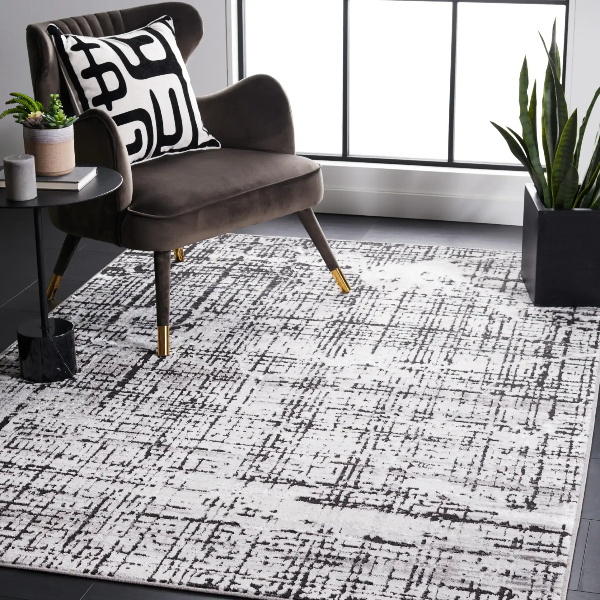 Amelia Distressed Grid Rug in Gray / Charcoal in a styled room