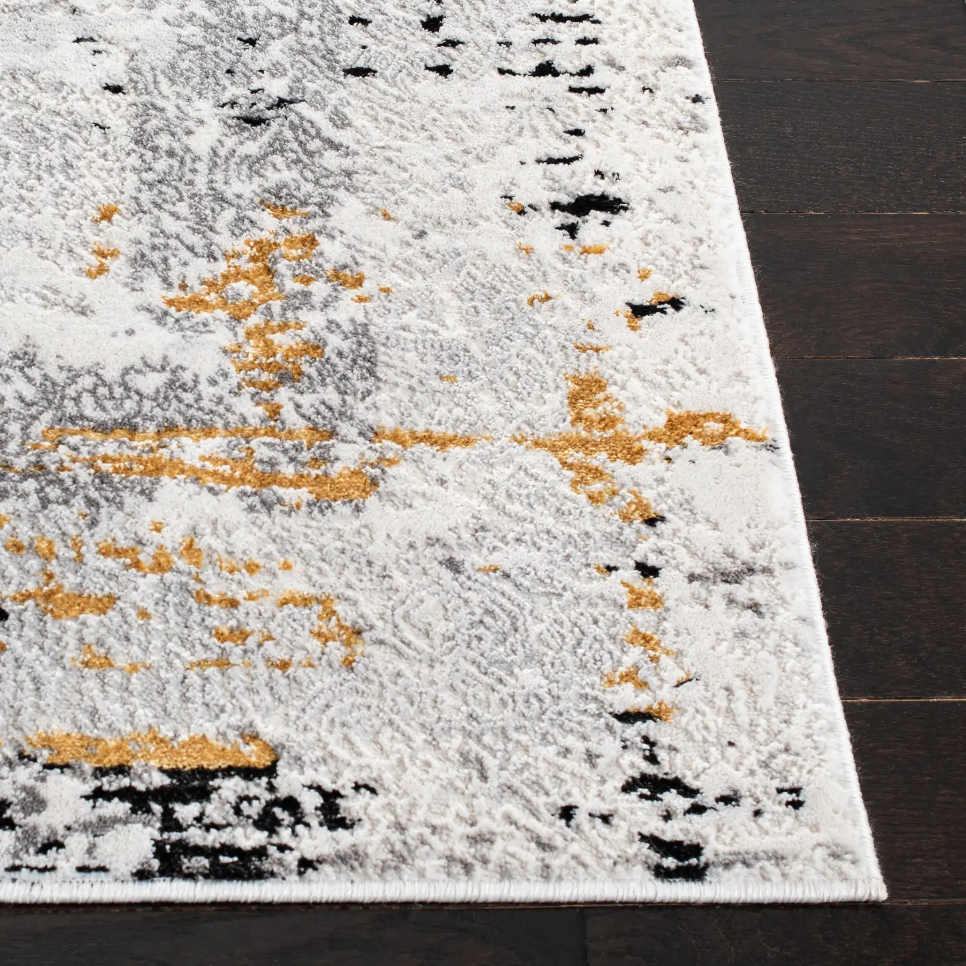 Amelia Distressed Border Rug in Gray / Gold in a styled room