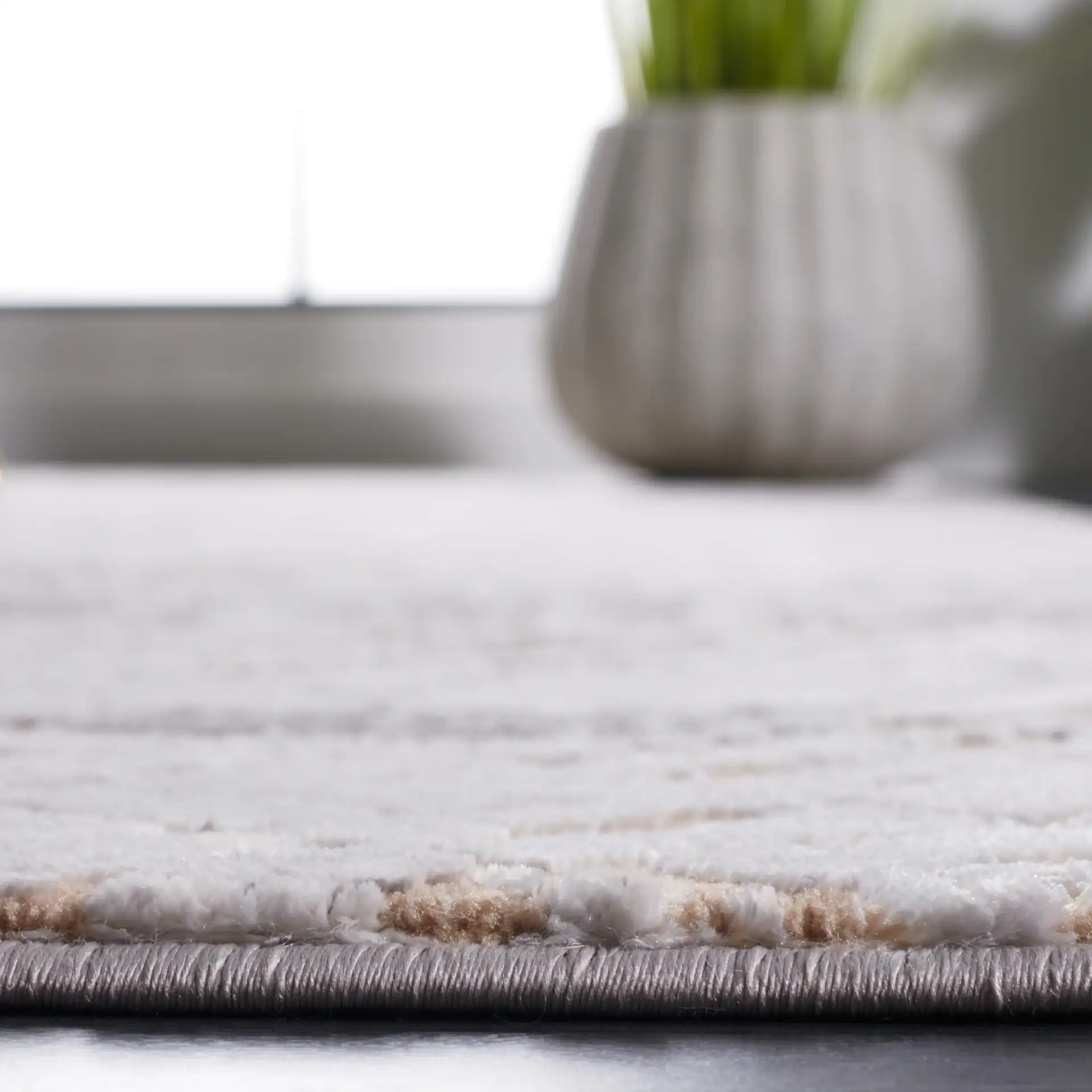 Amelia Distressed Trellis Rug in Gray / Beige in a styled room