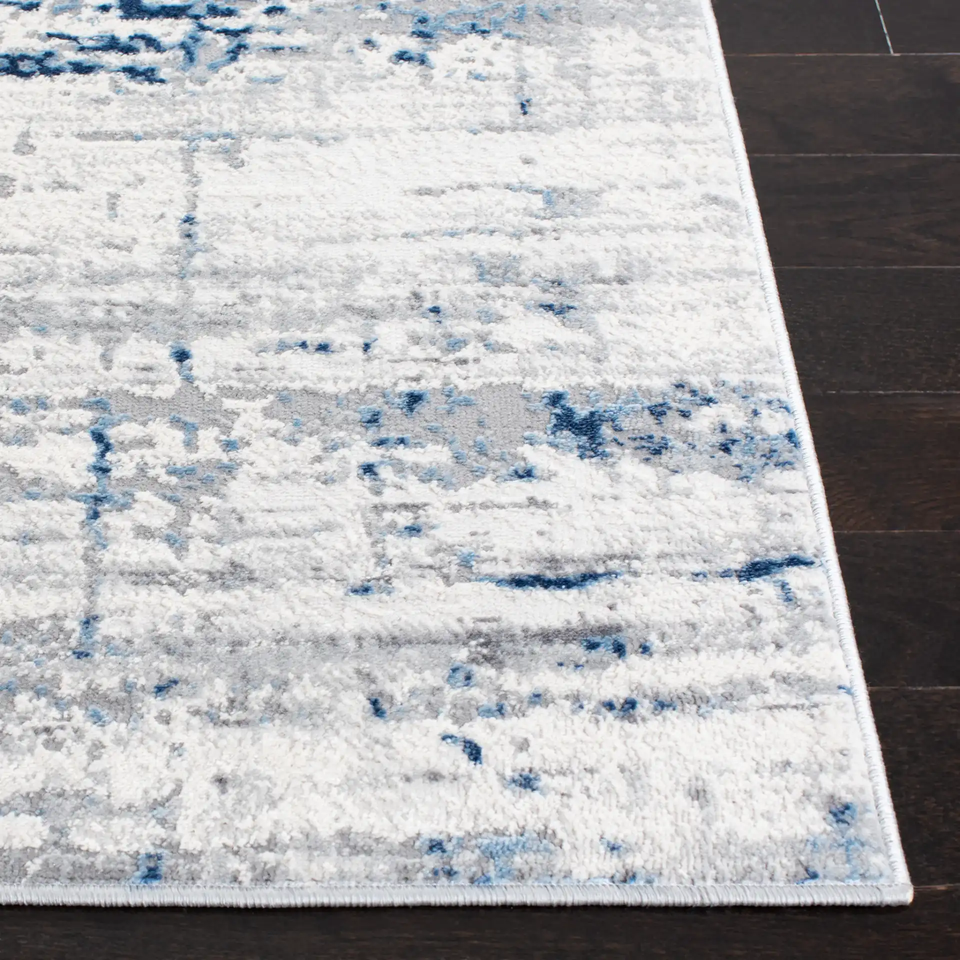 Amelia Abstract Linear Rug in Ivory / Blue in a styled room