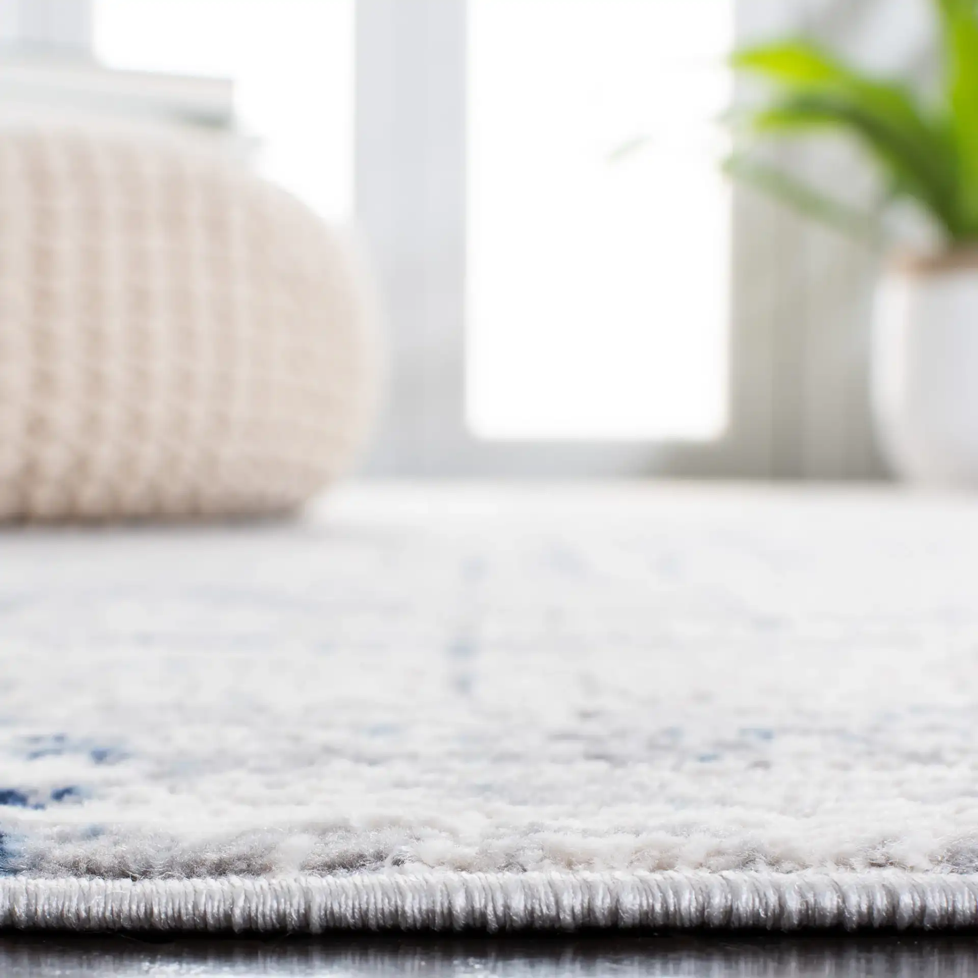 Amelia Abstract Linear Rug in Ivory / Blue in a styled room