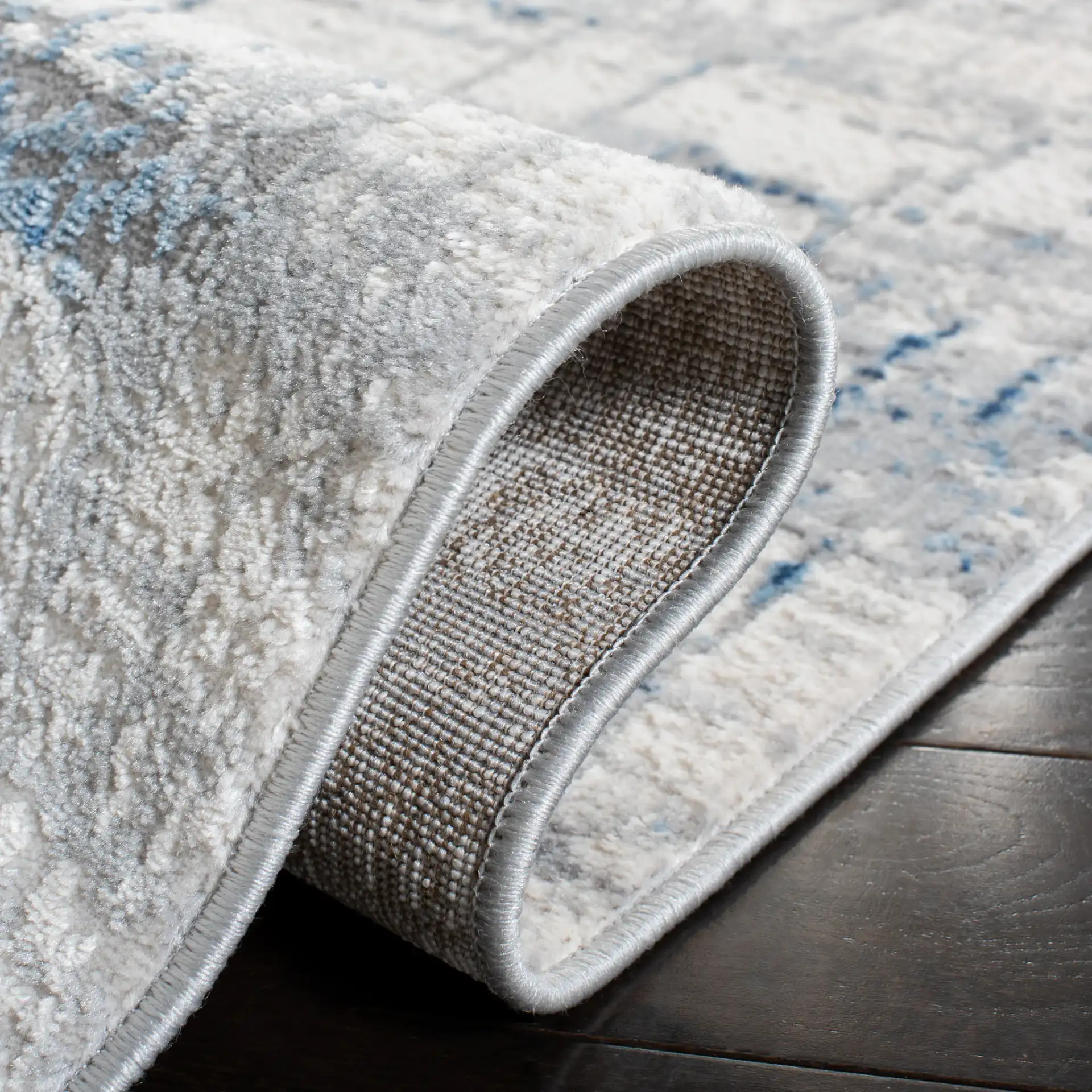 Amelia Abstract Linear Rug in Ivory / Blue in a styled room