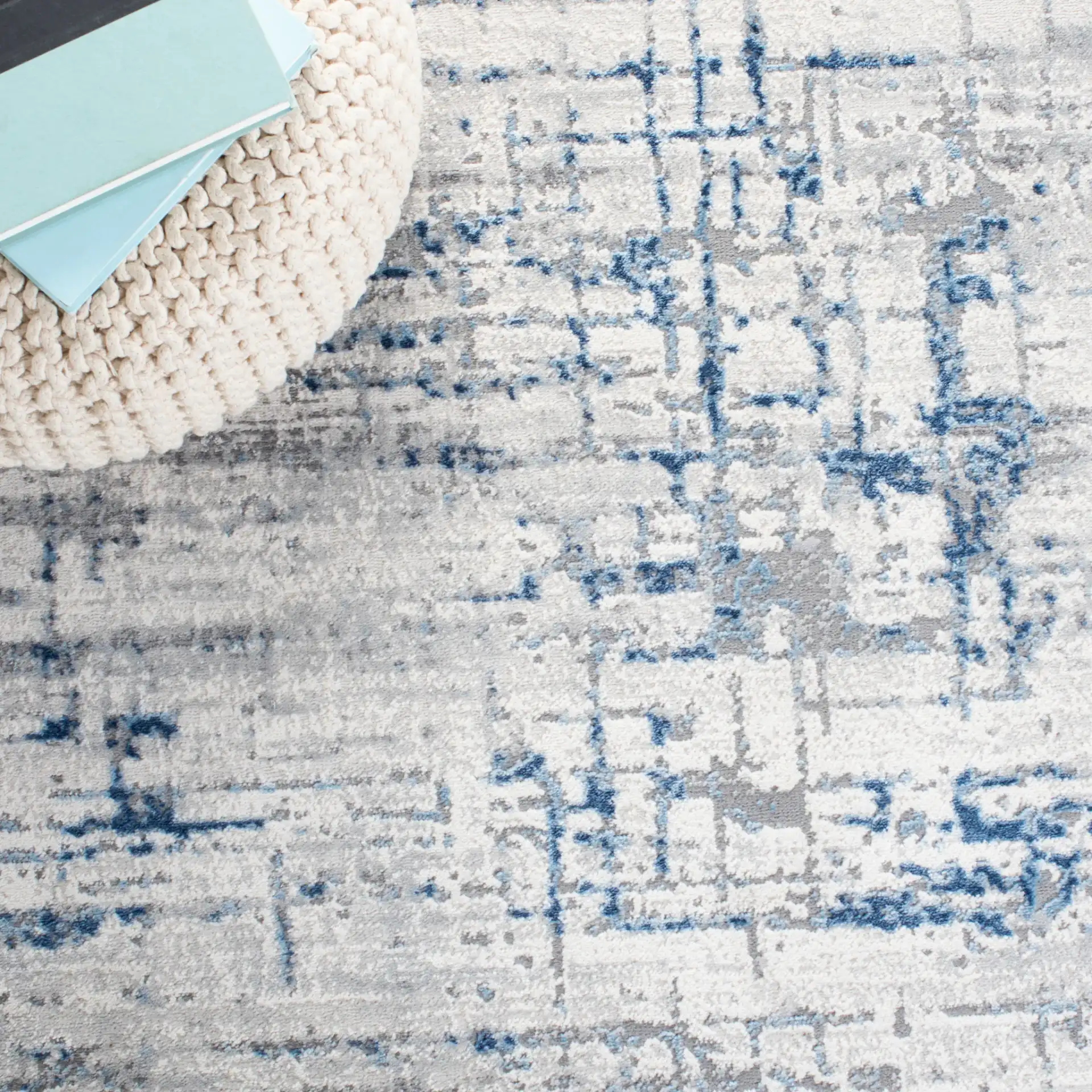 Amelia Abstract Linear Rug in Ivory / Blue in a styled room