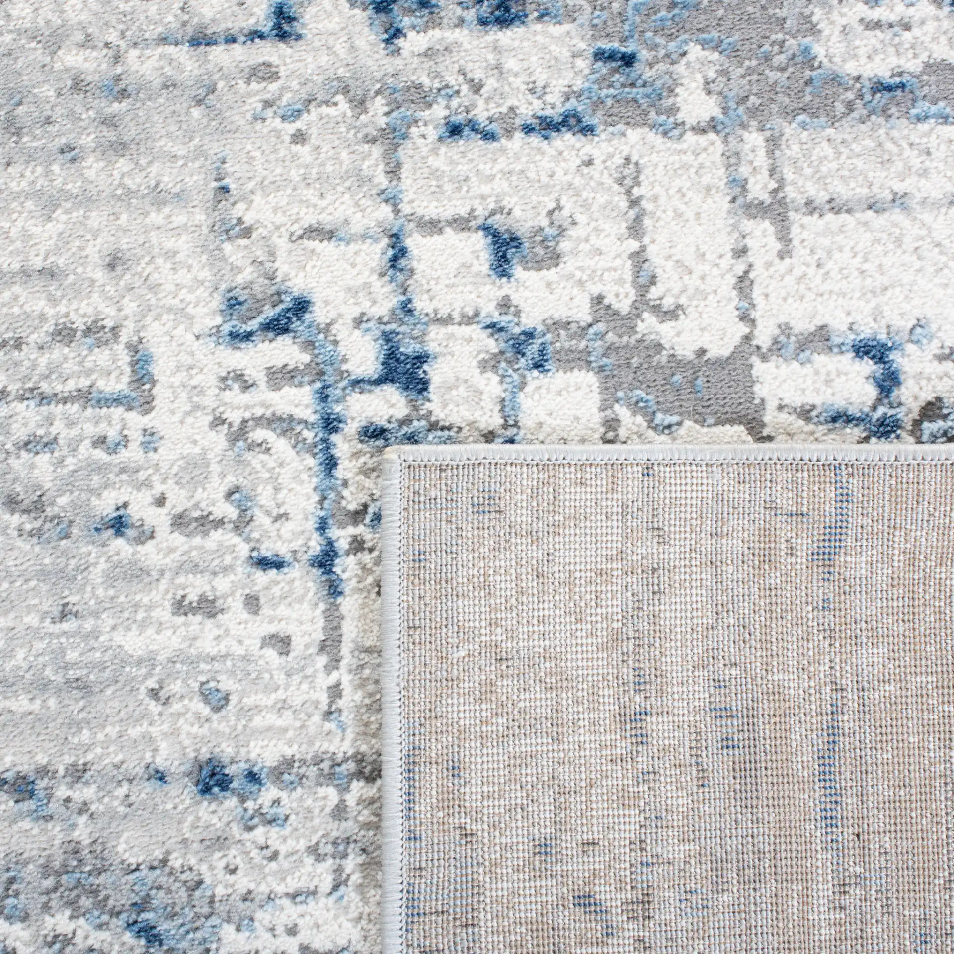 Amelia Abstract Linear Rug in Ivory / Blue in a styled room