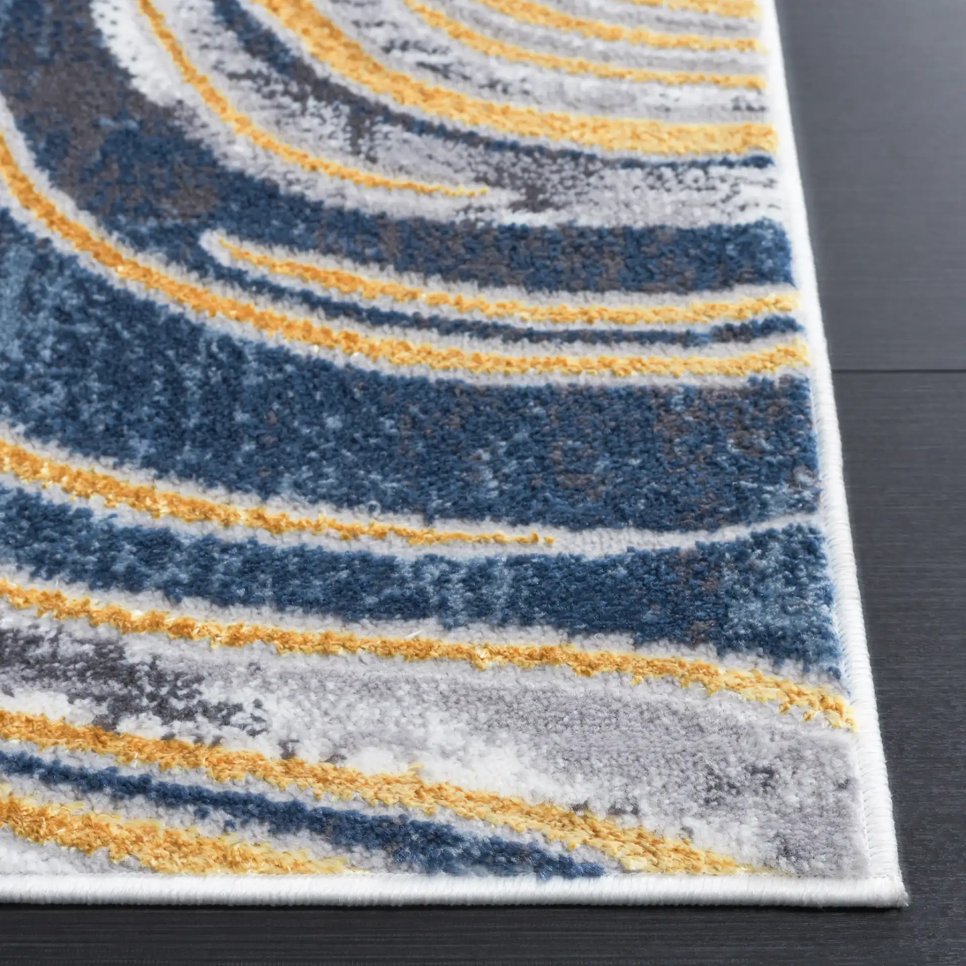 Amelia Abstract Waves Rug in Blue / Gold in a styled room