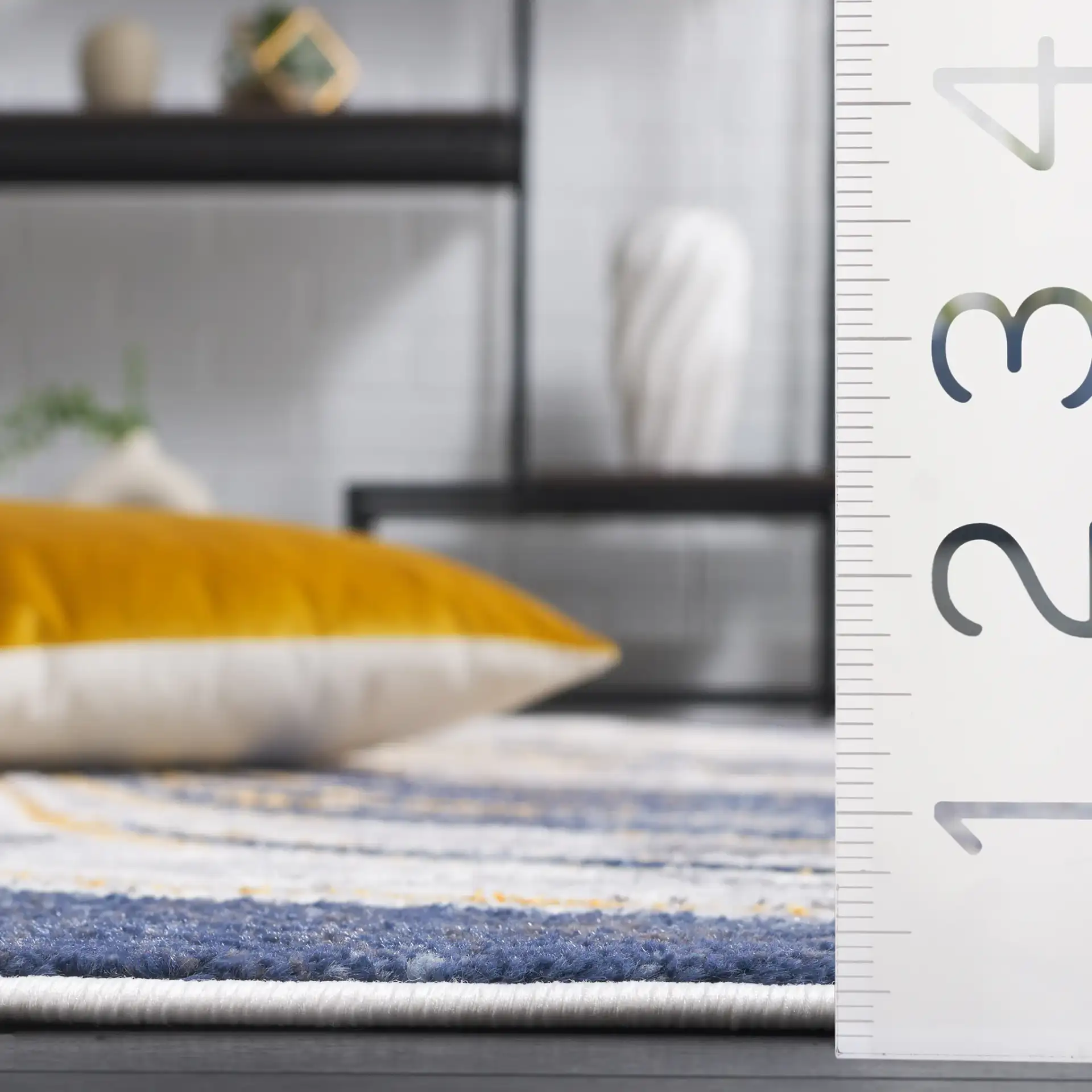 Amelia Abstract Waves Rug in Blue / Gold in a styled room