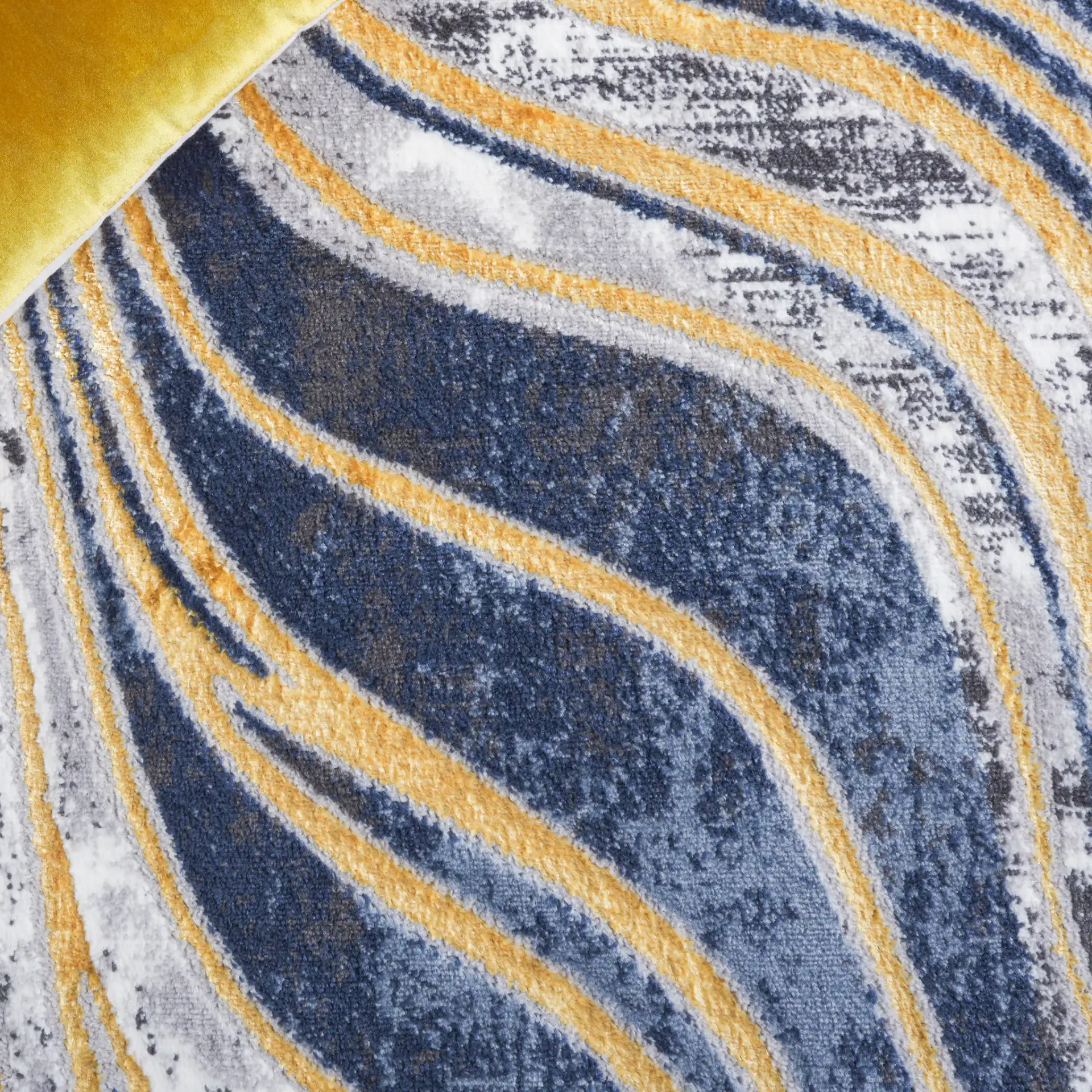 Amelia Abstract Waves Rug in Blue / Gold in a styled room