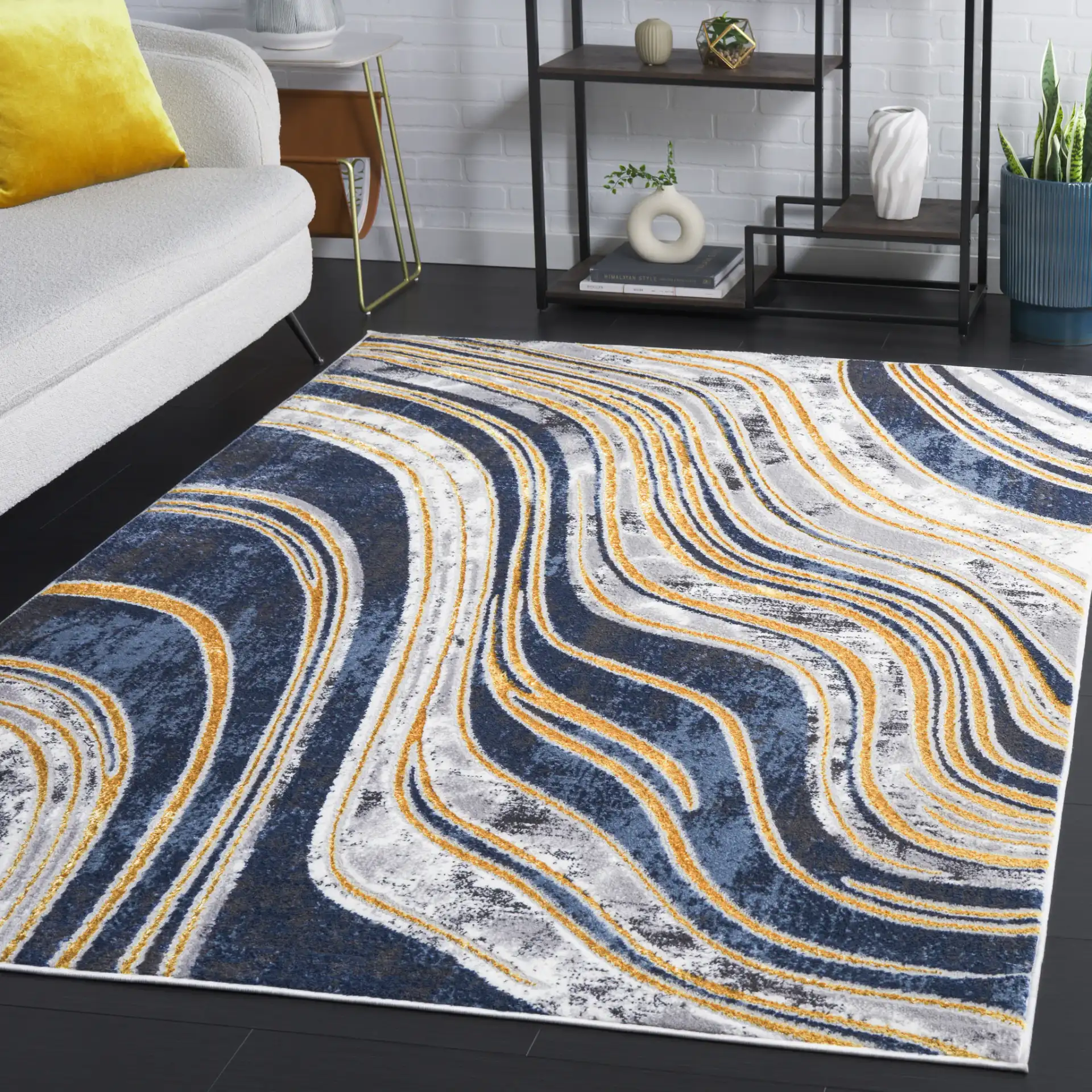 Amelia Abstract Waves Rug in Blue / Gold in a styled room