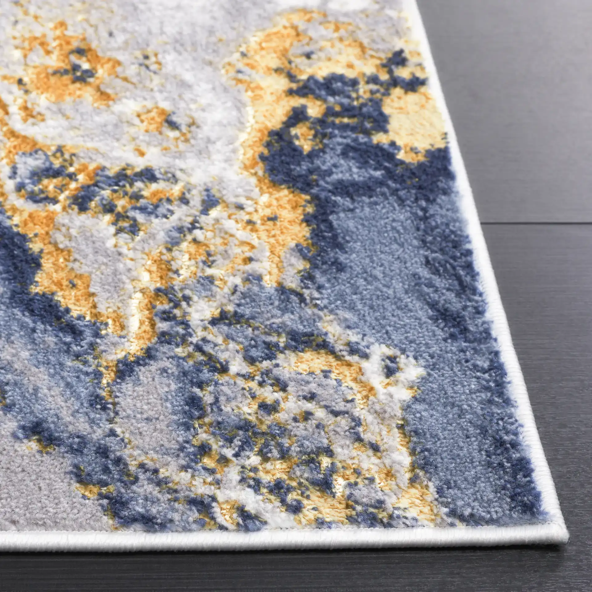 Amelia Geode Abstract Rug in Blue / Gold in a styled room
