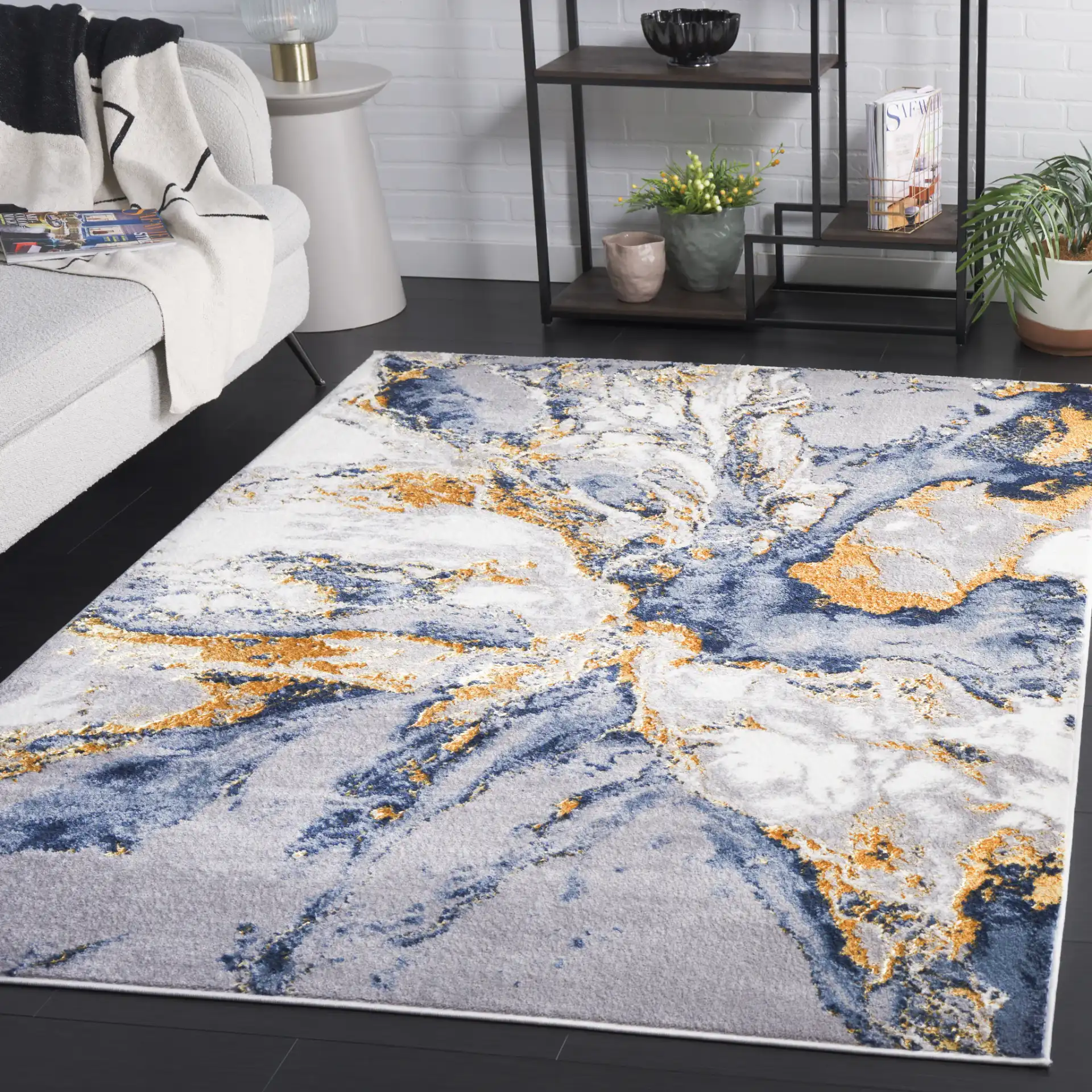 Amelia Geode Abstract Rug in Blue / Gold in a styled room