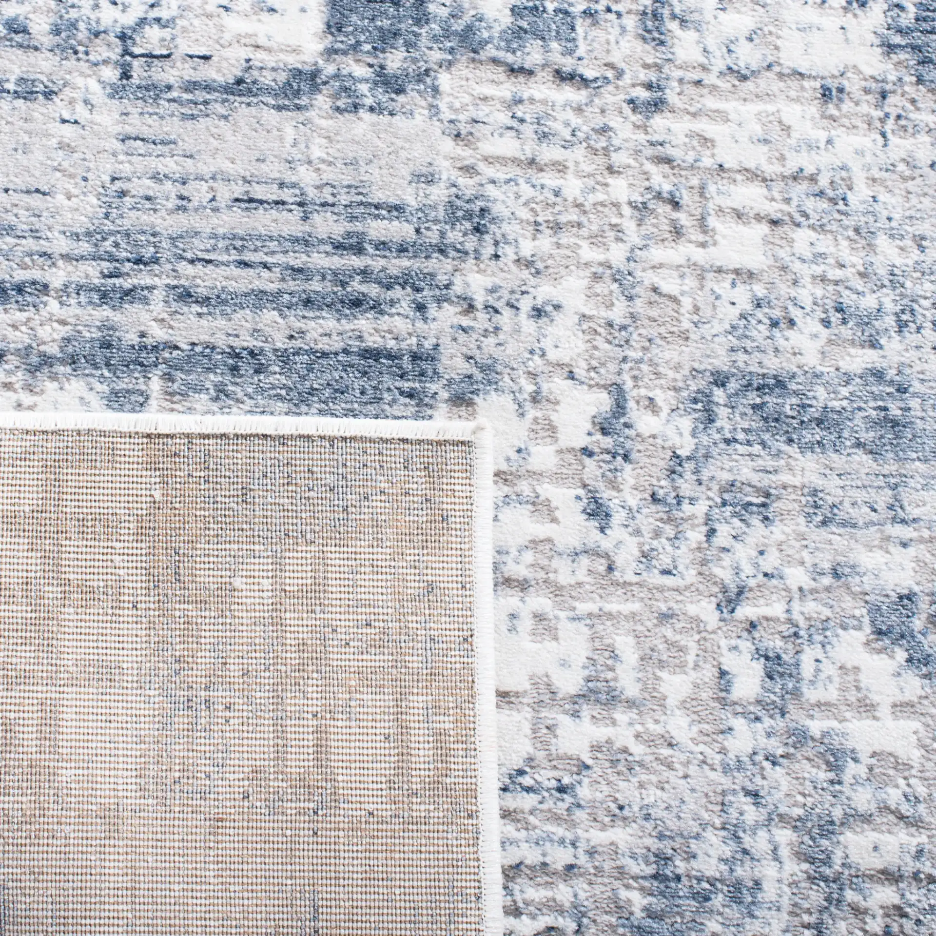 Amelia Abstract Grid Rug in Blue / Gray in a styled room