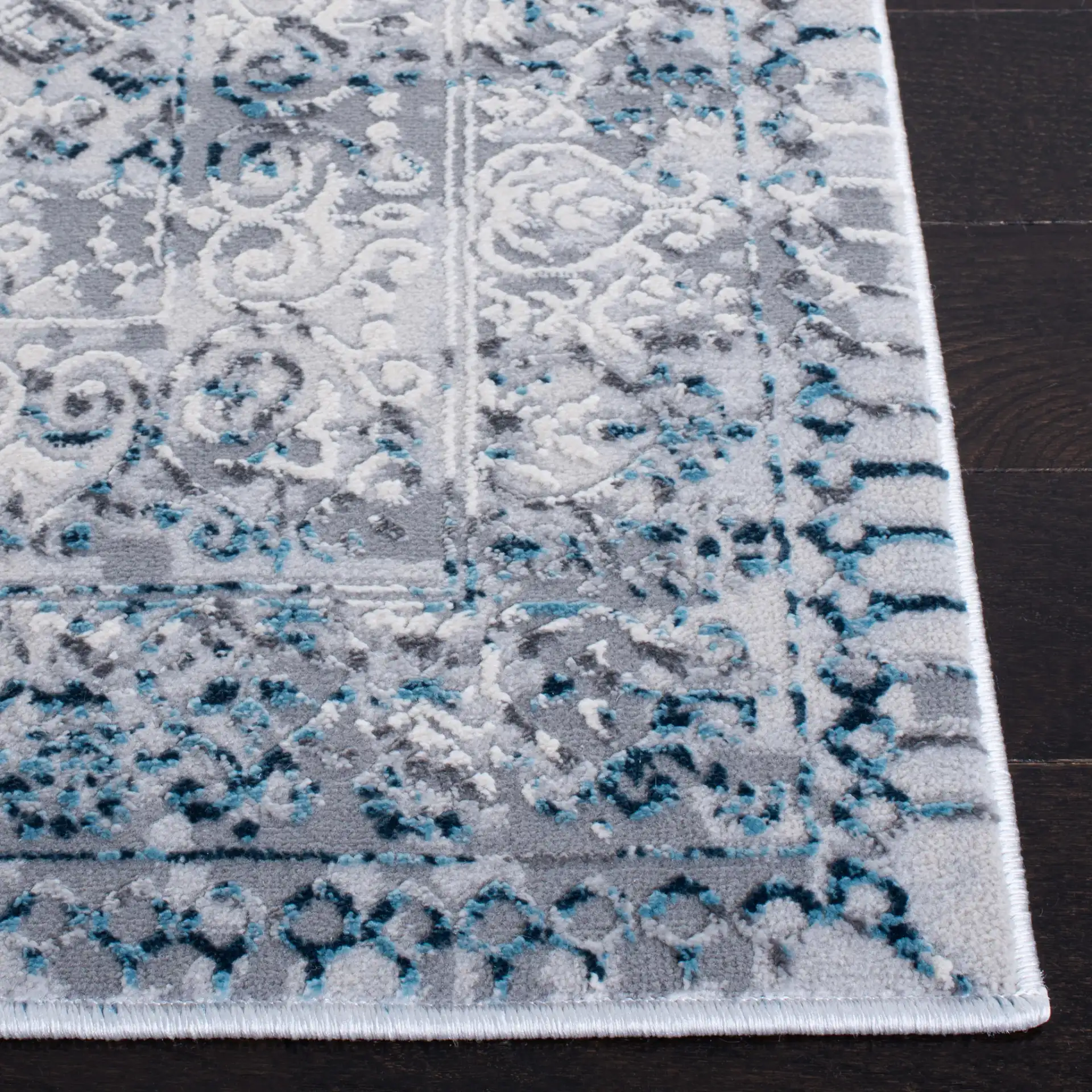 Alhambra Distressed Bordered Rug in Cream / Turquoise in a styled room