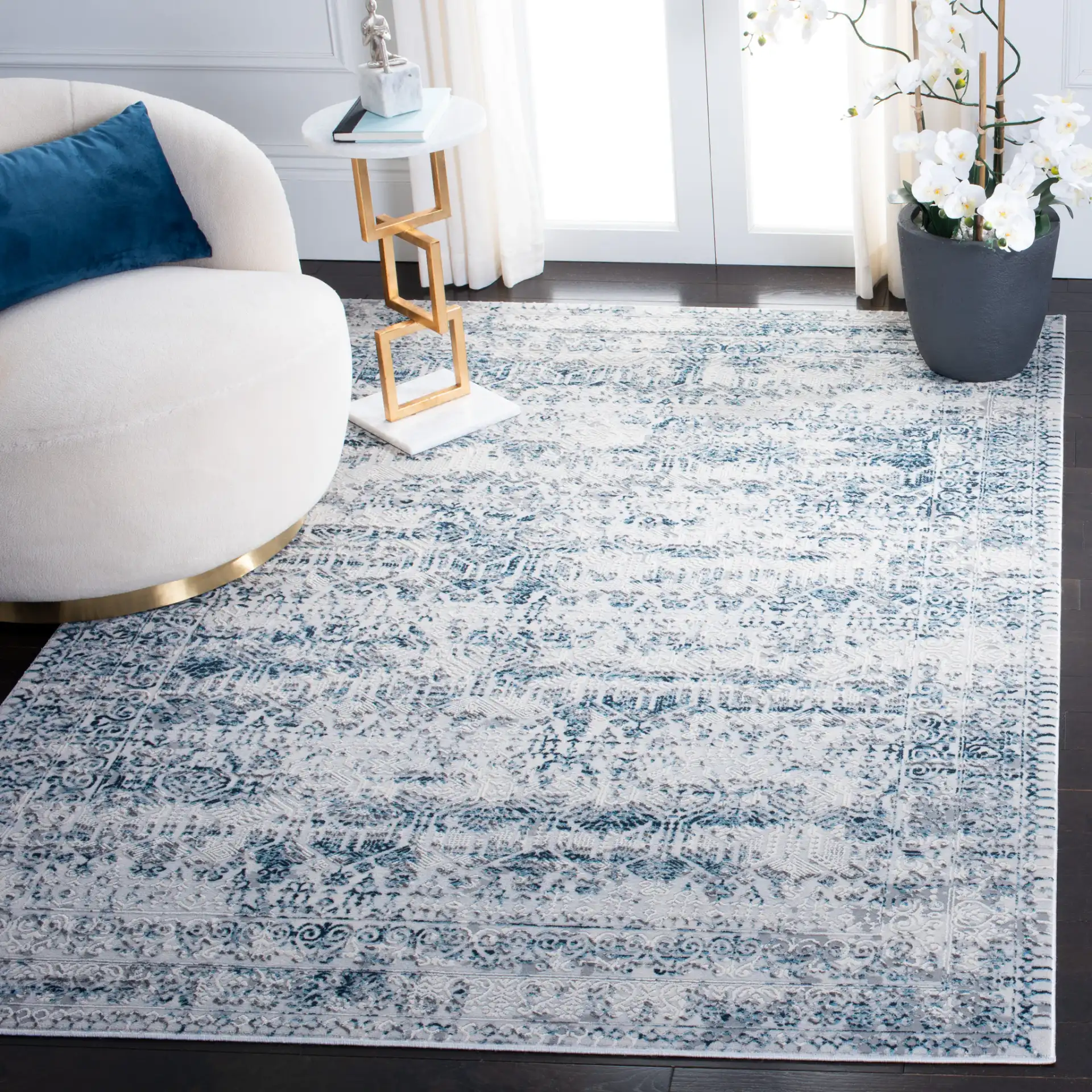 Alhambra Distressed Bordered Rug in Cream / Turquoise in a styled room