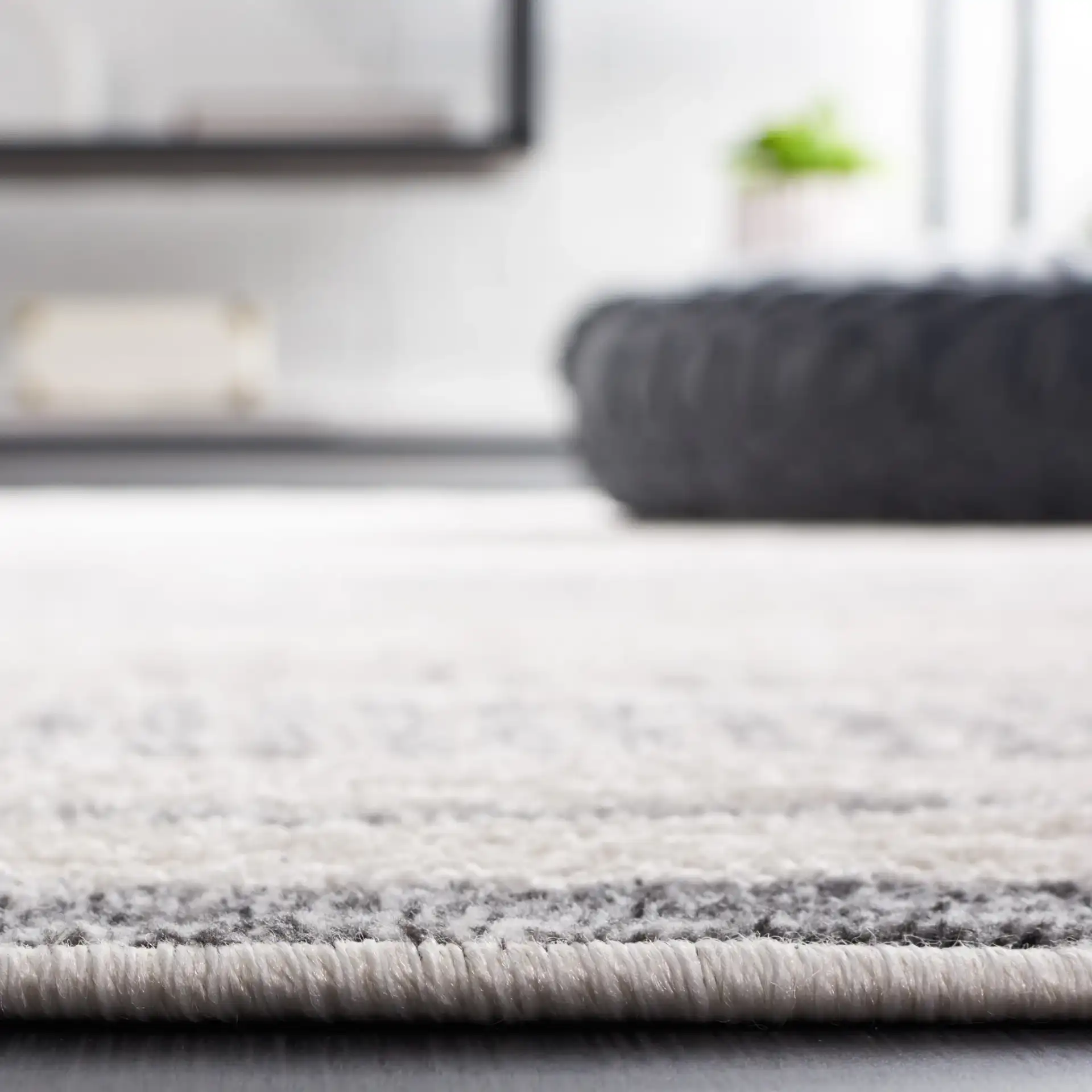 Alamo Linear Sphere Rug in Ivory / Gray in a styled room