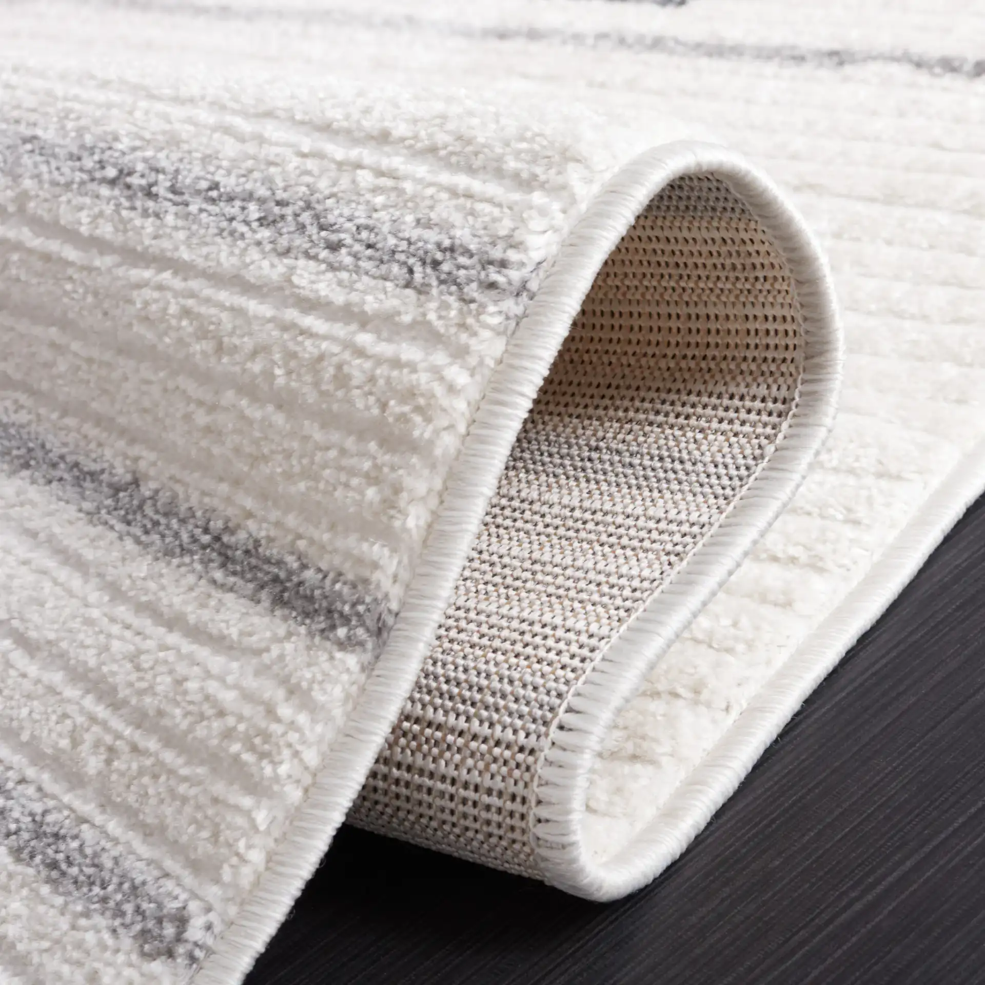 Alamo Linear Sphere Rug in Ivory / Gray in a styled room