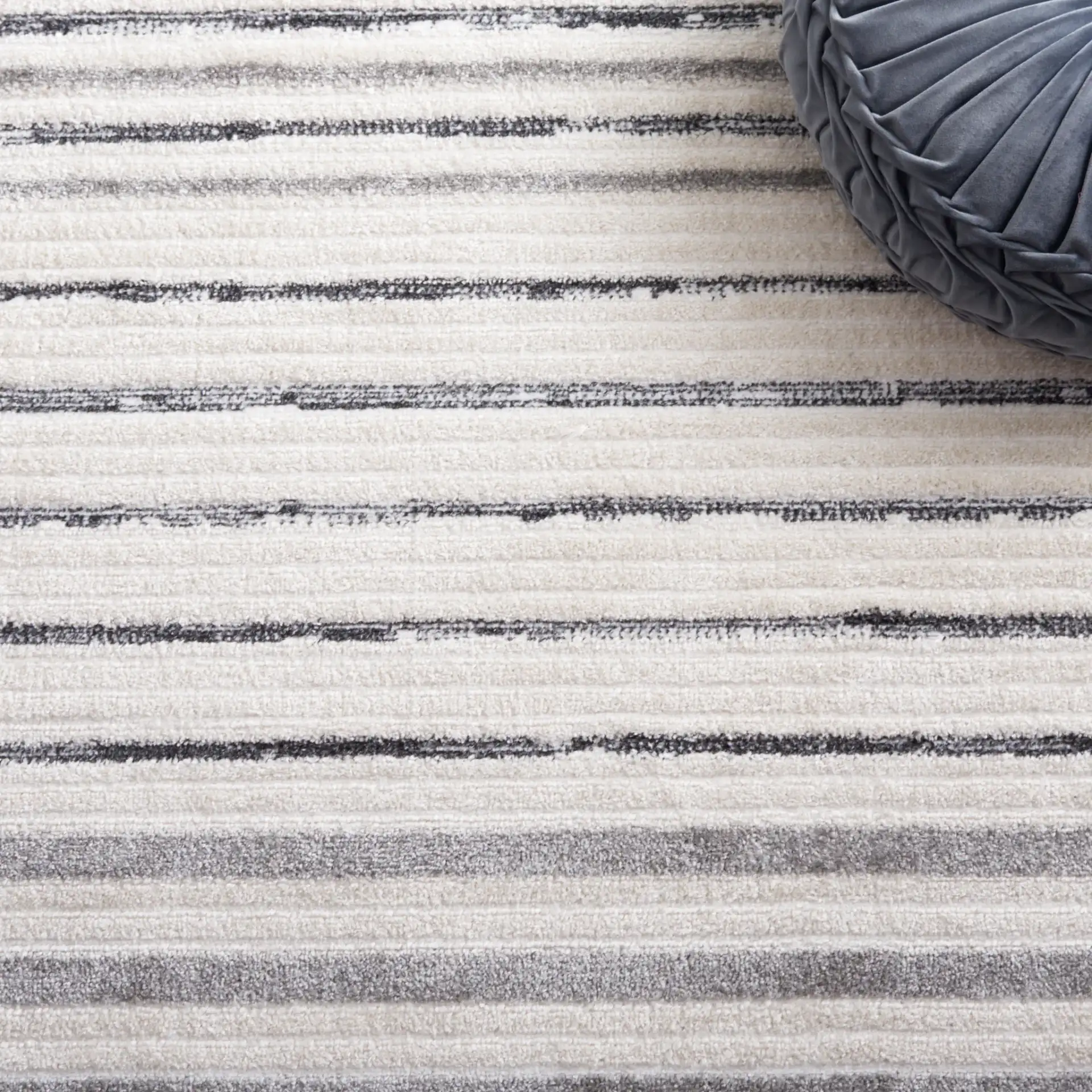 Alamo Linear Sphere Rug in Ivory / Gray in a styled room