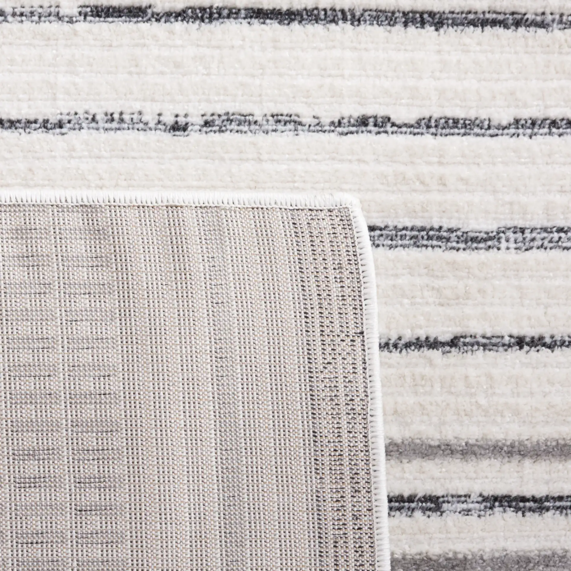 Alamo Linear Sphere Rug in Ivory / Gray in a styled room