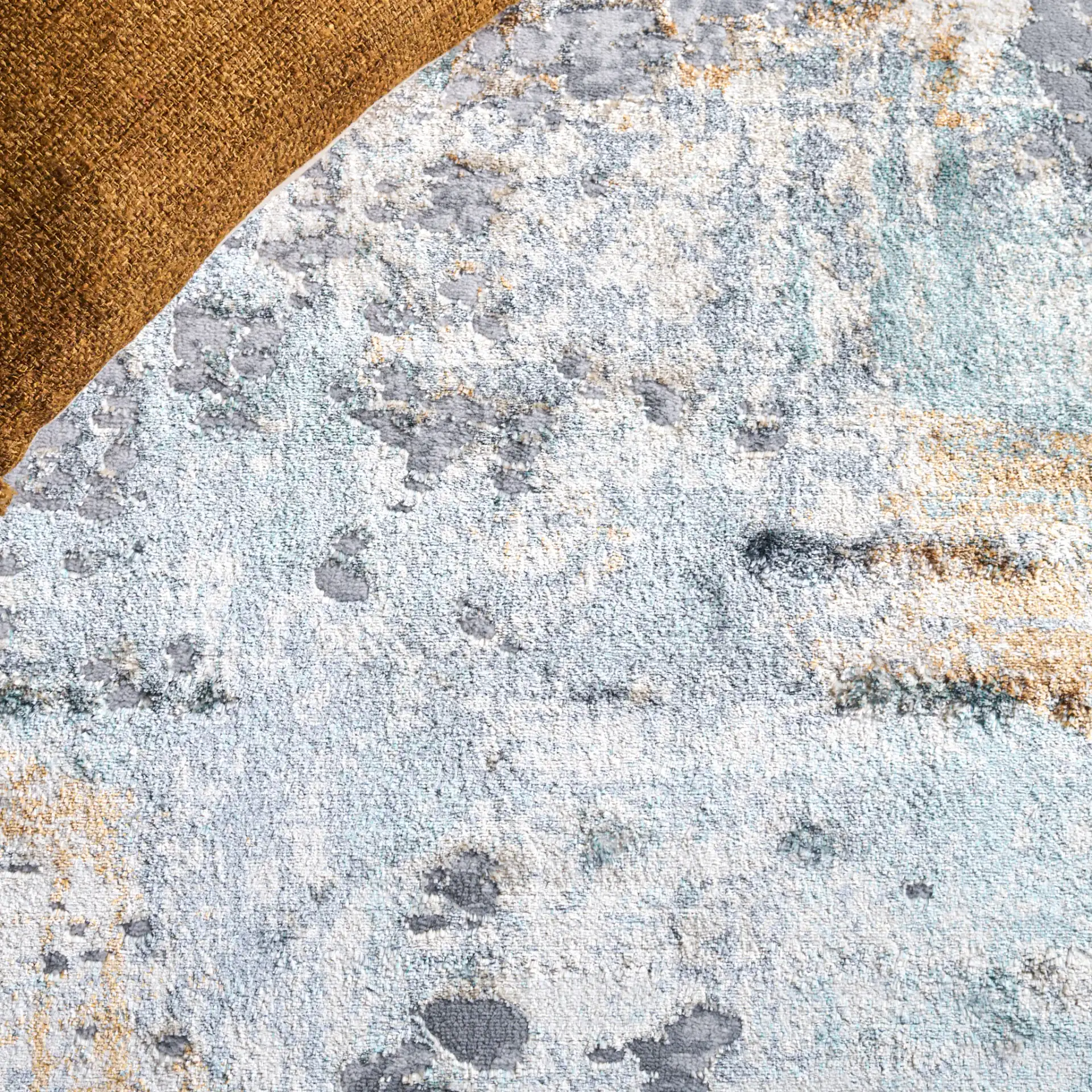 Alenia Mottled Abstract Rug in Gray / Beige in a styled room