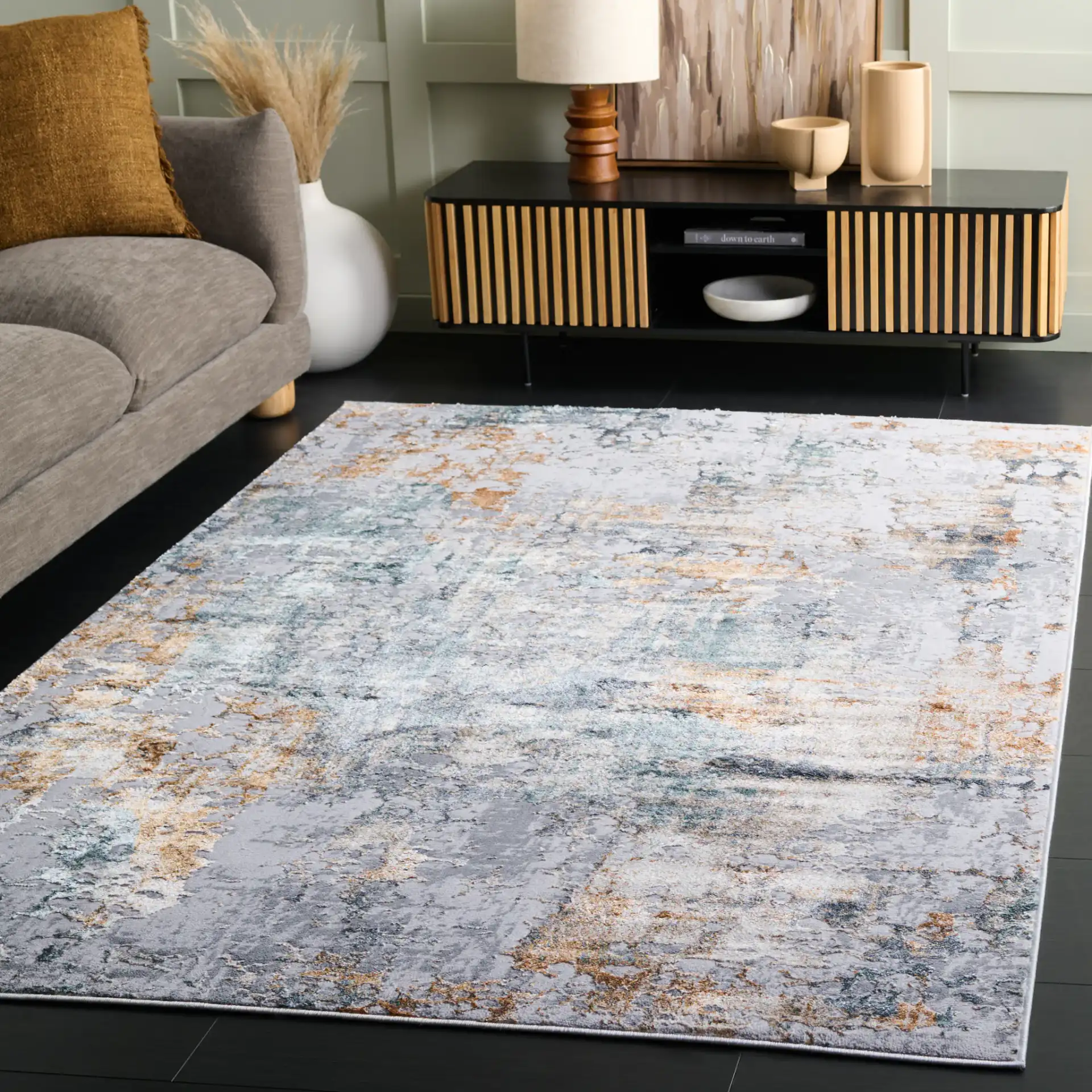 Alenia Mottled Abstract Rug in Gray / Beige in a styled room