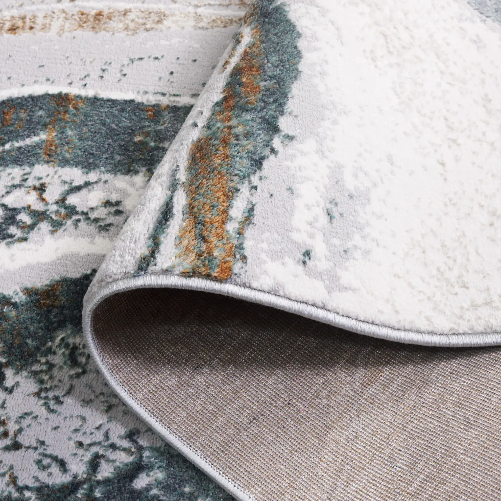Alenia Marble Band Rug in Gray / Ivory in a styled room