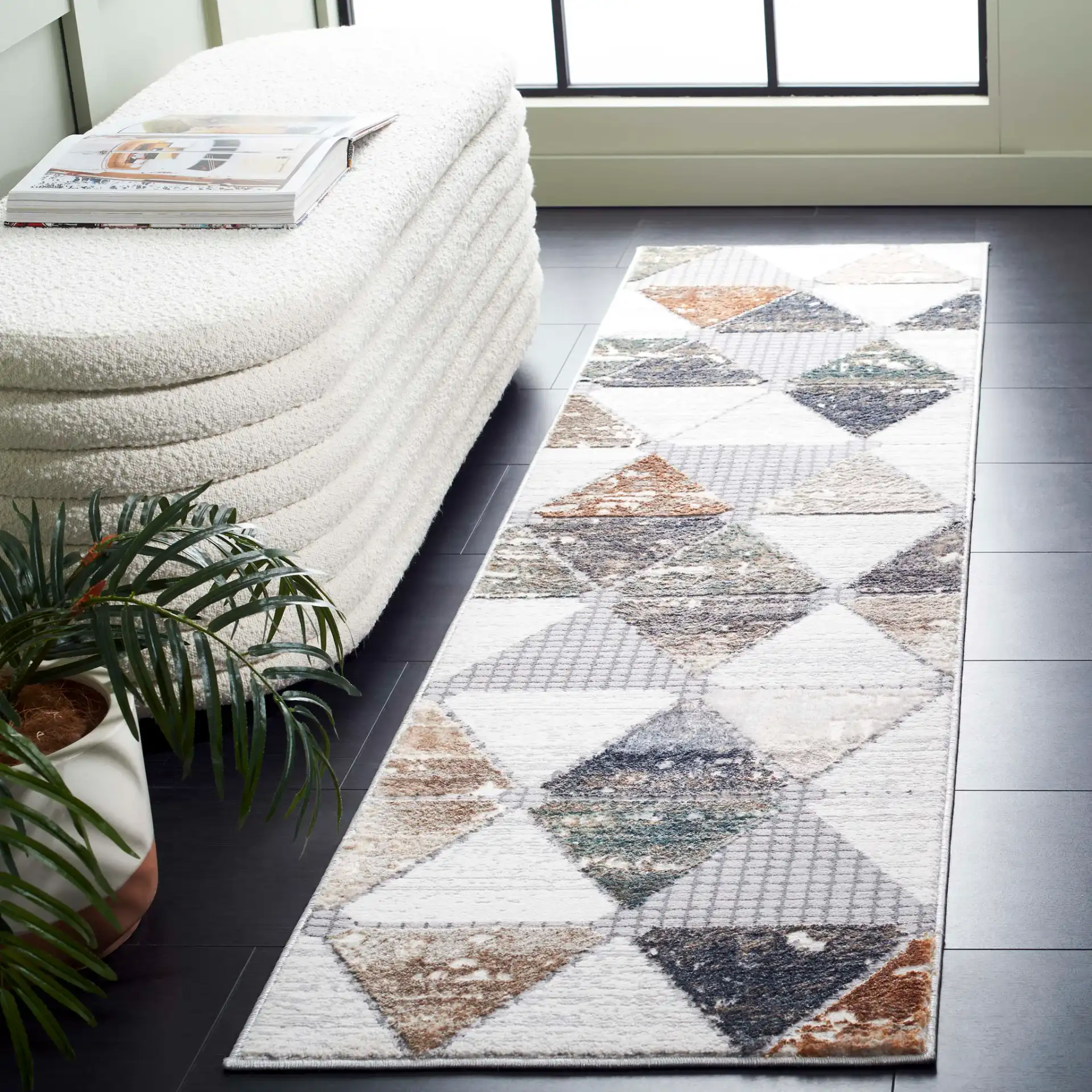Alenia Interlocking Triangle Rug in Gray / Beige in a styled room
