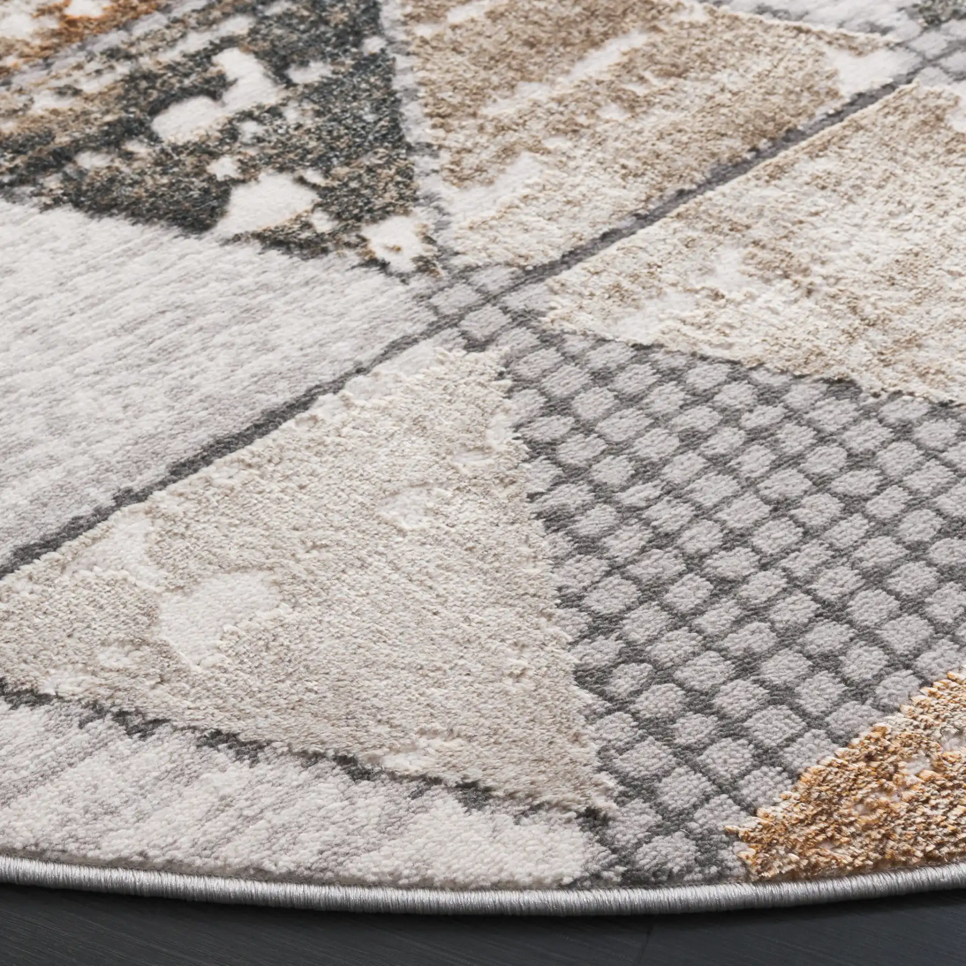Alenia Interlocking Triangle Rug in Gray / Beige in a styled room