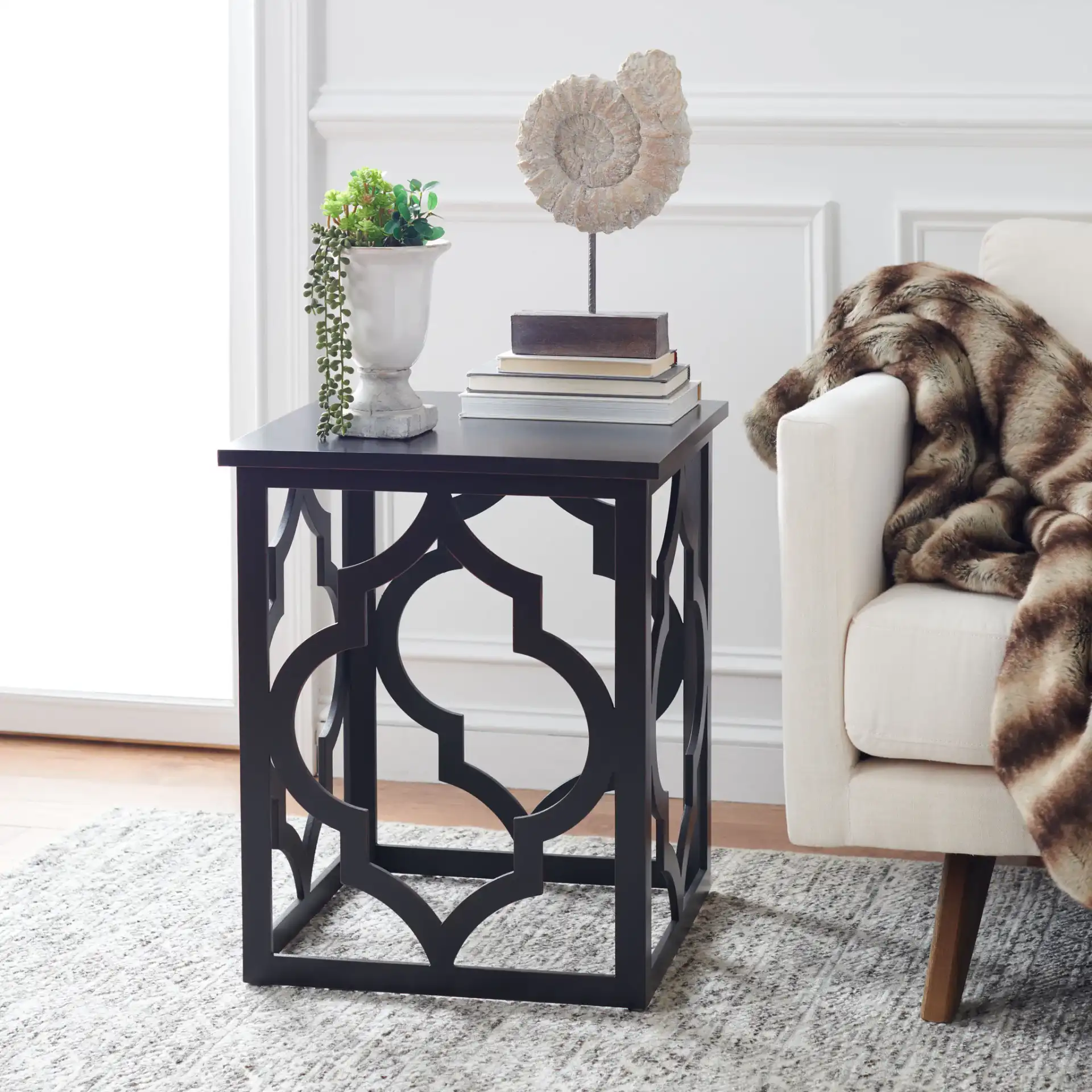 Milo End Table in Black in a styled room