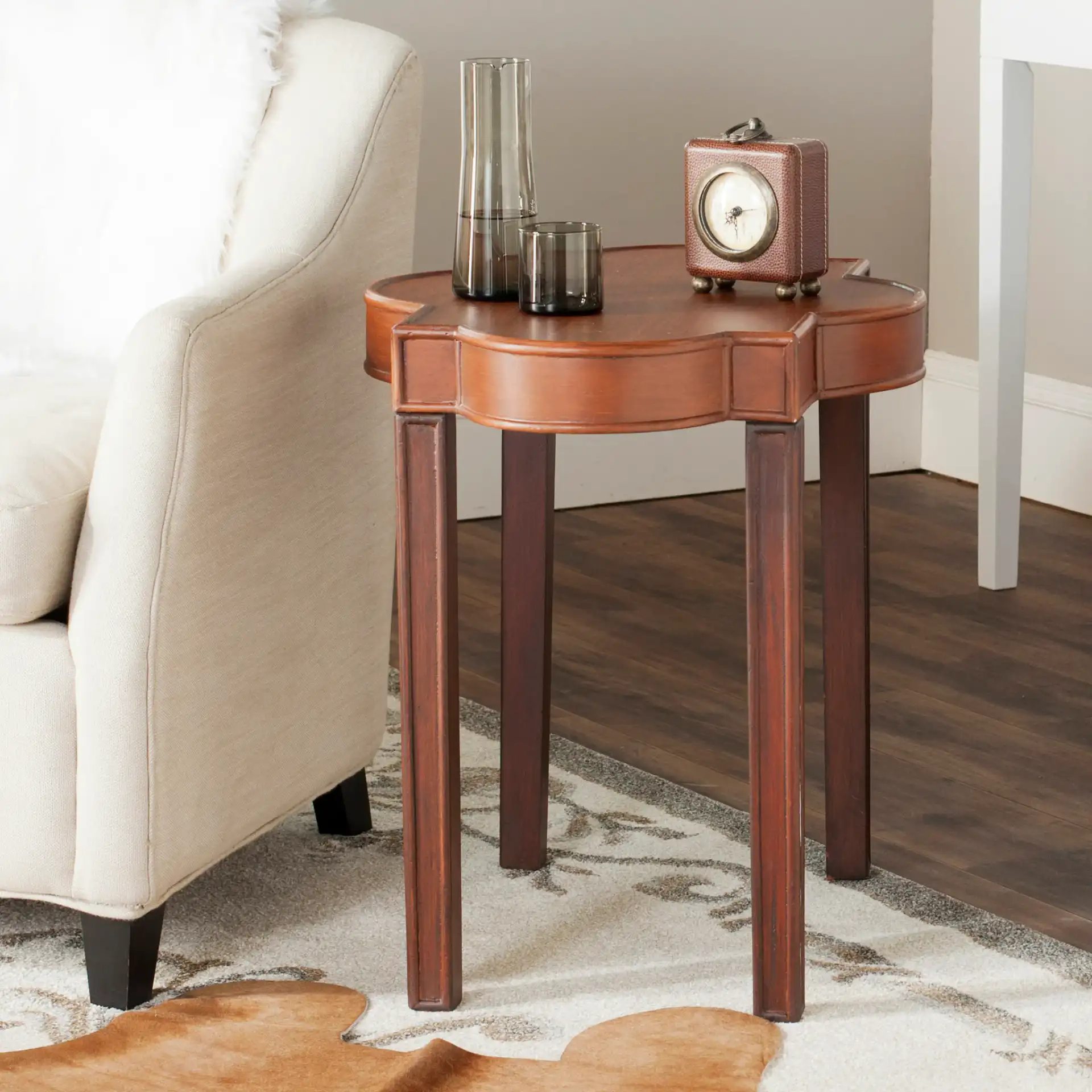 Mizell End Table in Brown in a styled room