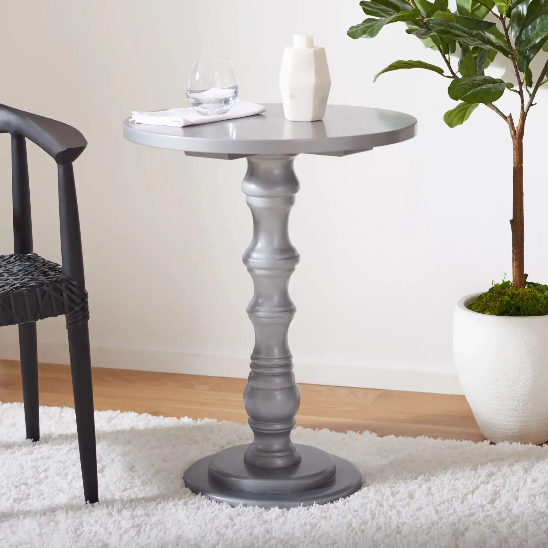 Greta Accent Table in Gold in a styled room