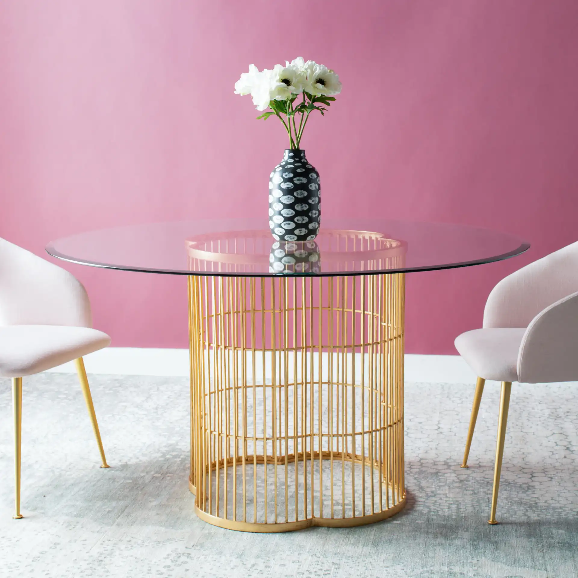 Noore 54-Inch Gold Dining Table in Gold / Clear in a styled room
