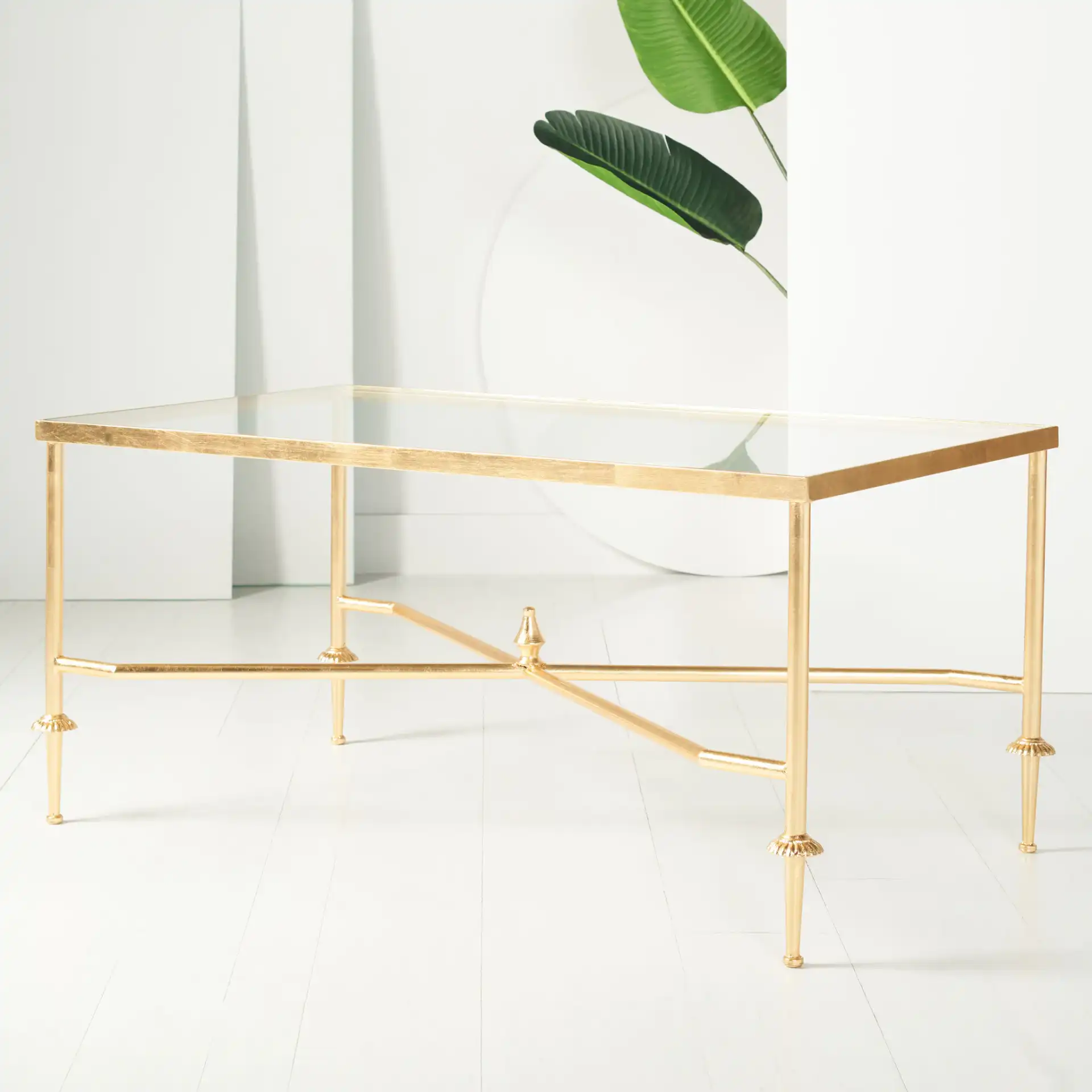 Devi Gold Leaf Coffee Table in Gold in a styled room