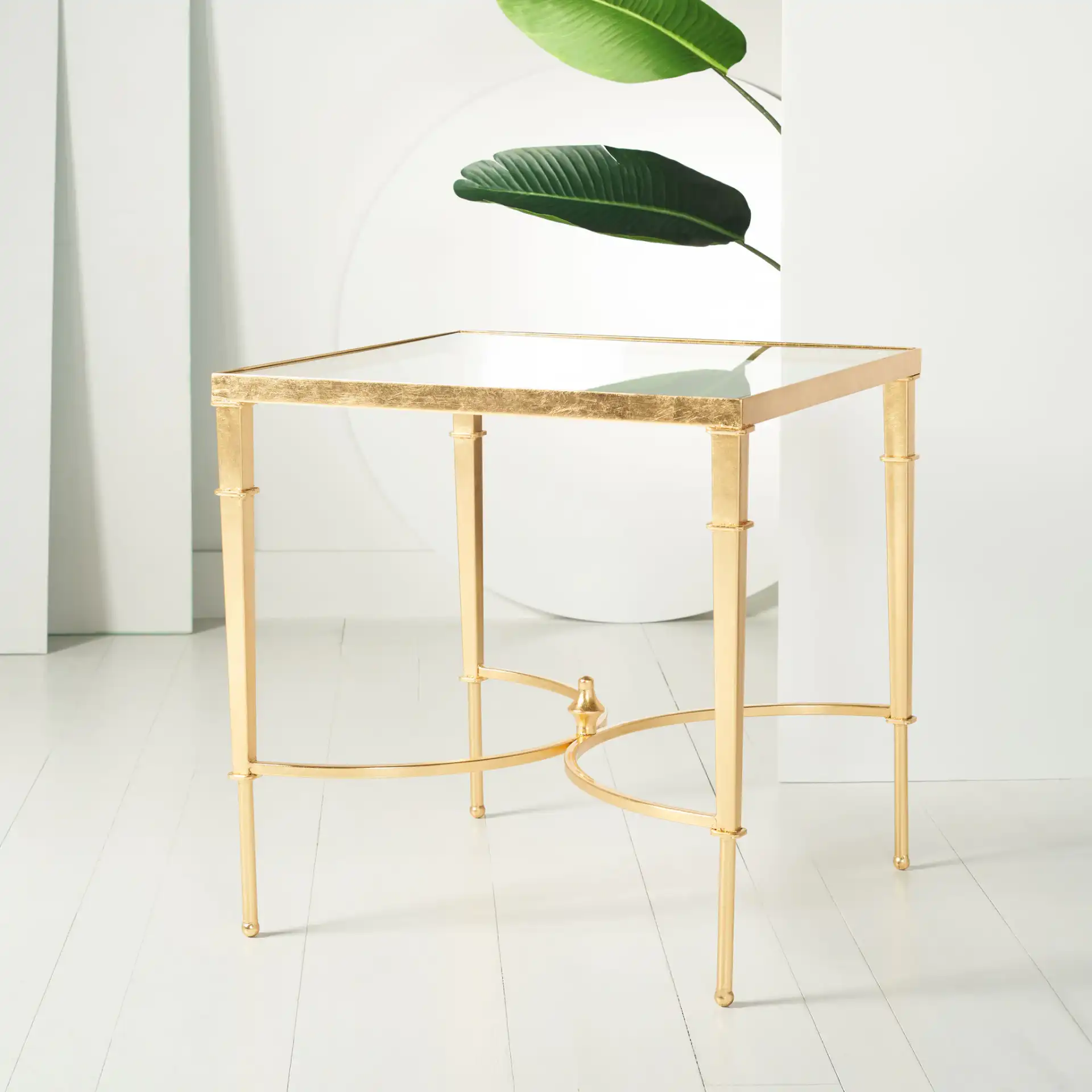 Mendez Gold Leaf Accent Table in Gold in a styled room