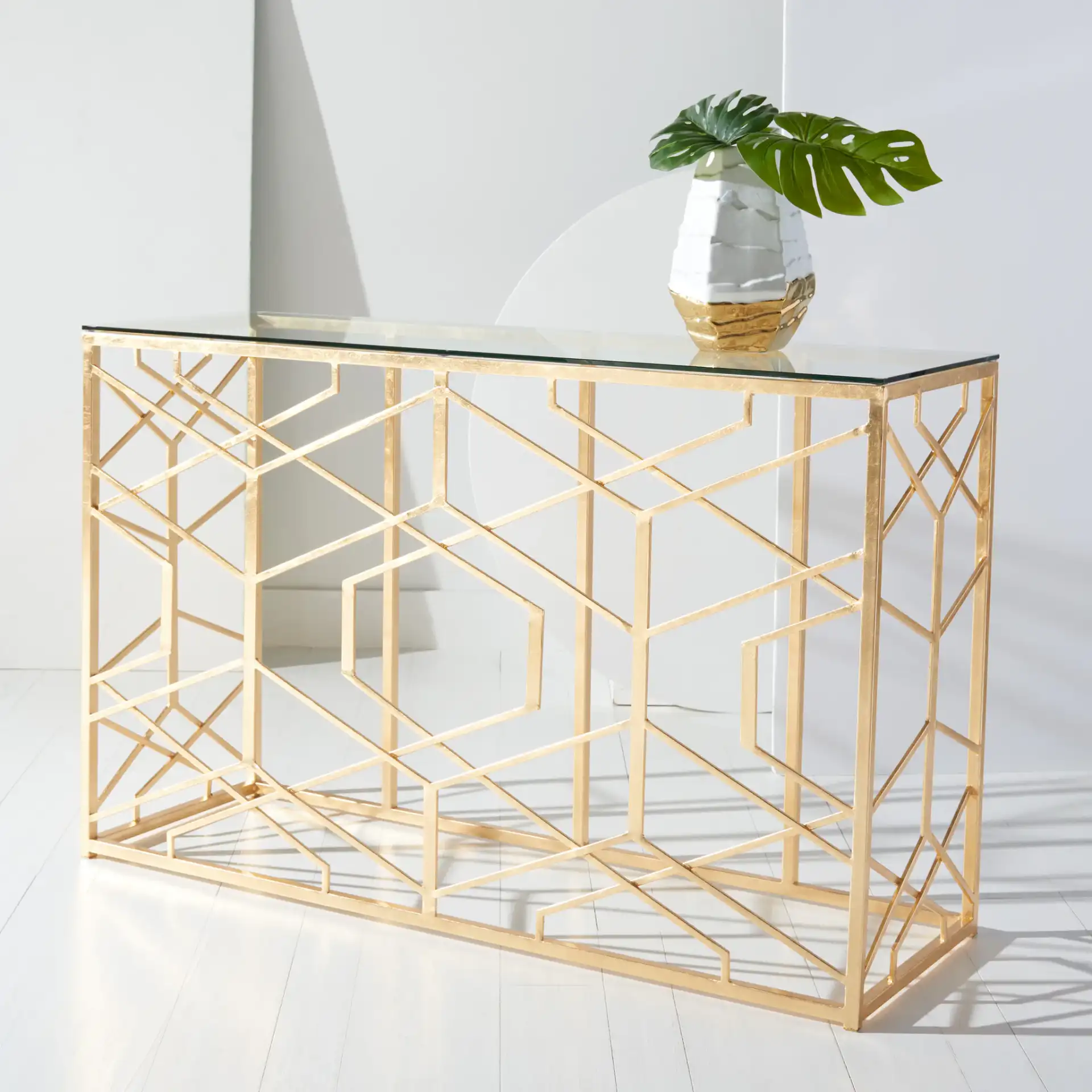Sean Gold Leaf Console Table in Gold in a styled room