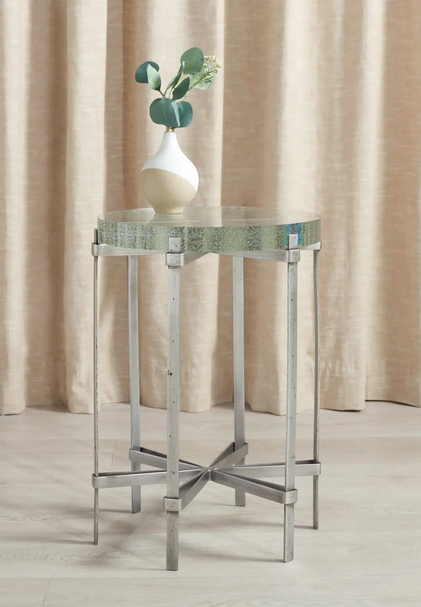 Evyanna Round Bubble Glass Table in Silver / Clear in a styled room