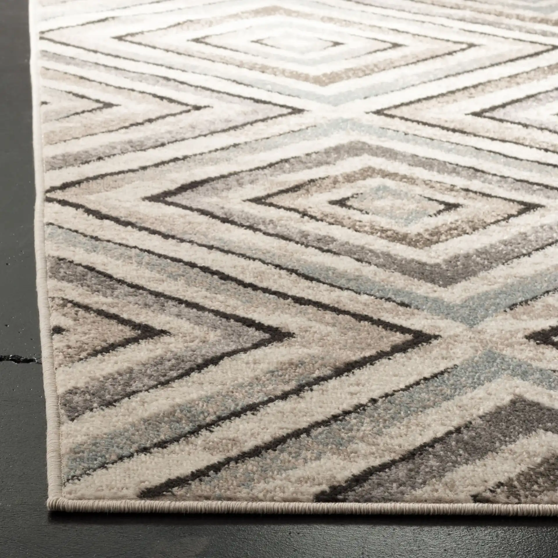 Amsterdam Nested Diamond Rug in Cream / Beige in a styled room